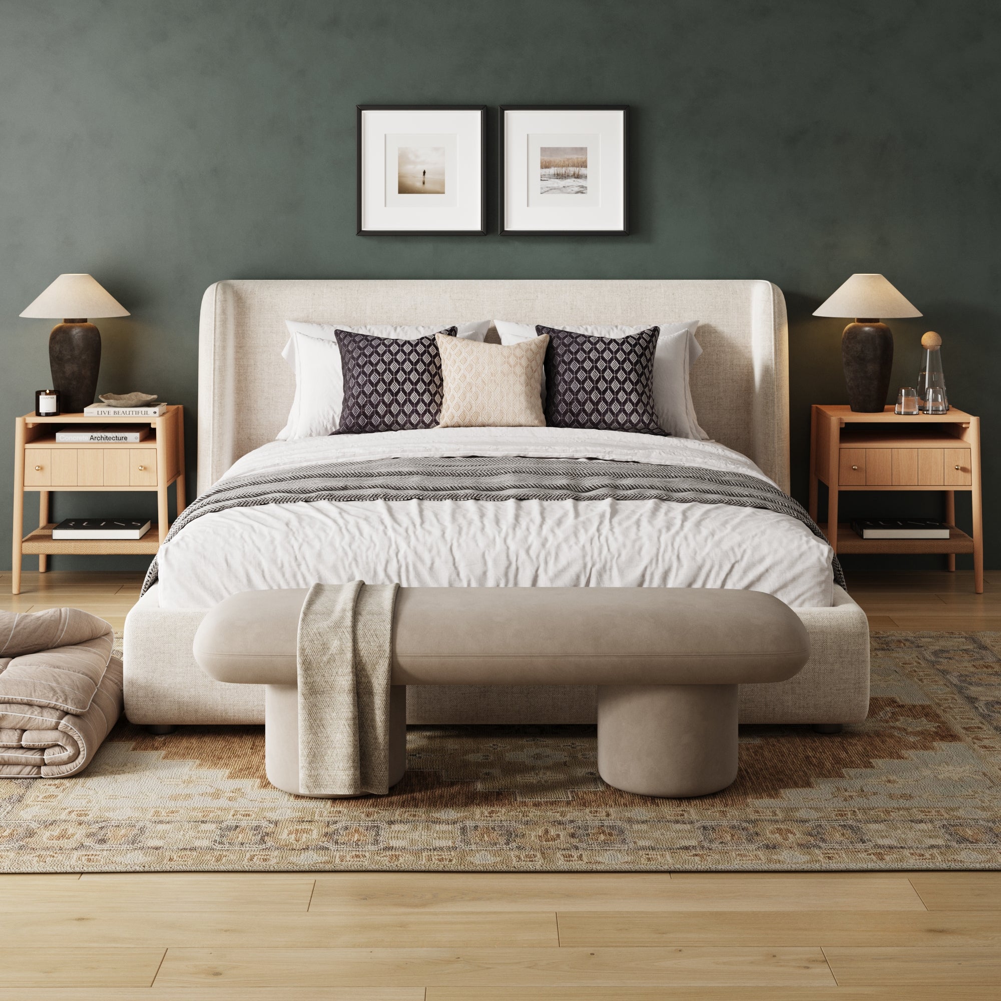 A modern bedroom featuring a beige upholstered bed, patterned pillows, bench, Nathan James Wood Nightstand with Drawer & Seagrass Storage Raw Oak (Set of 2) with lamps, framed art above the bed, and a cozy neutral rug on light wood flooring.