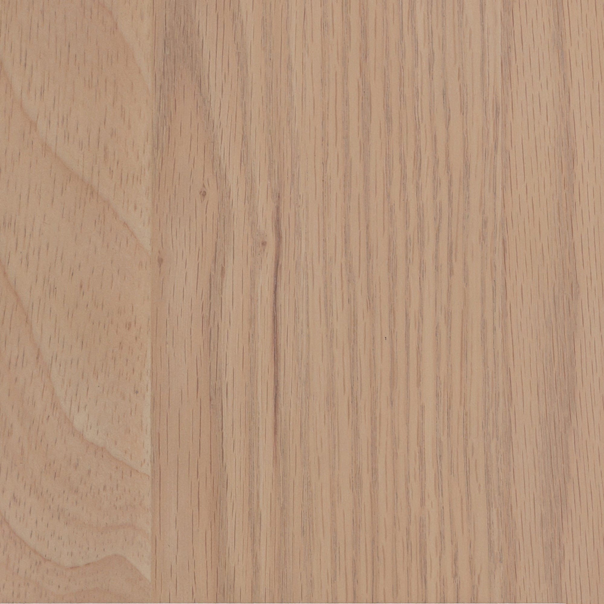 A close-up view of a flat, light brown wooden surface with a subtle, horizontal grain pattern and a smooth, matte finish.