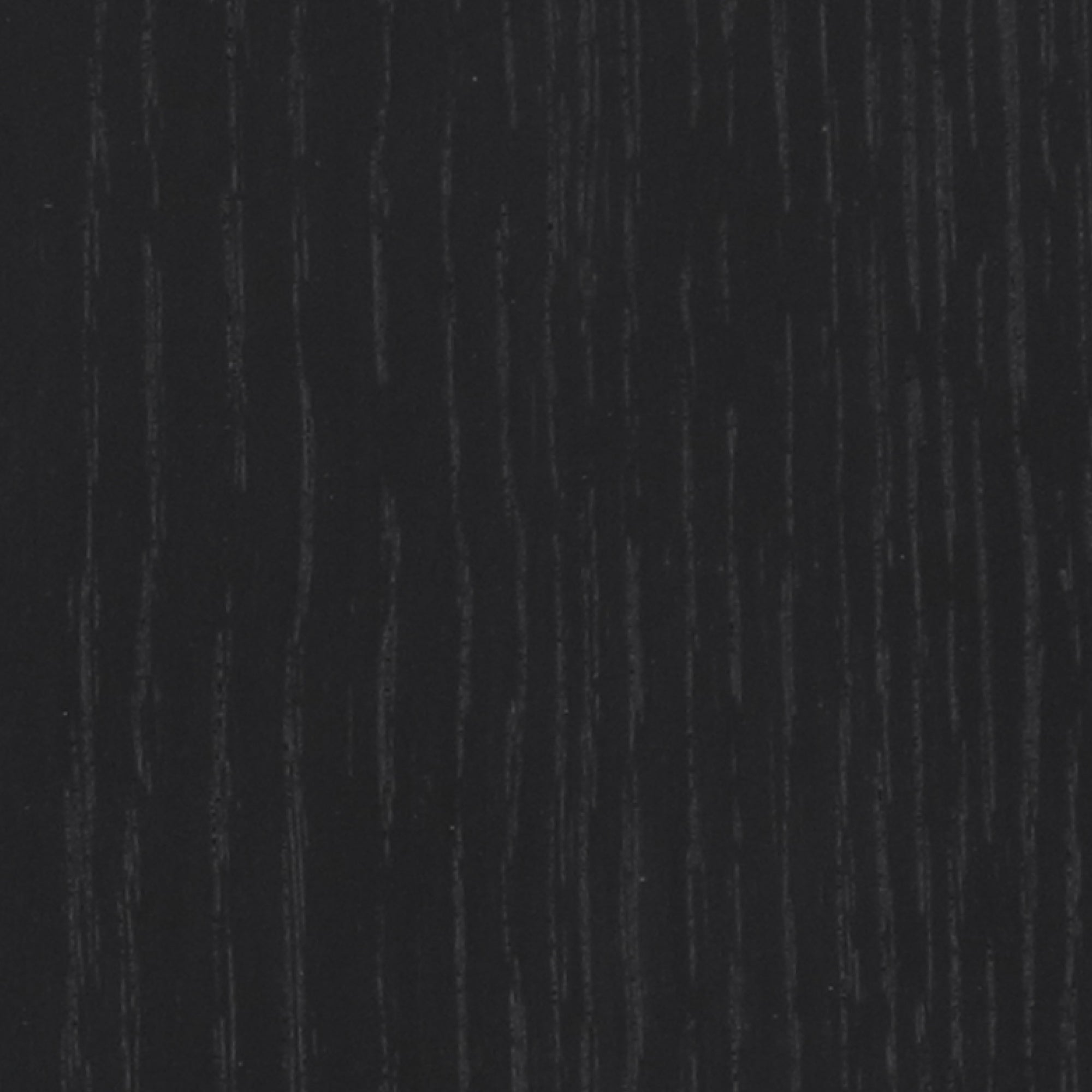 Close-up of a dark wood surface with subtle vertical grain patterns. The wood texture is visible, with slight variations in shade and thin, wavy lines running parallel across the image.