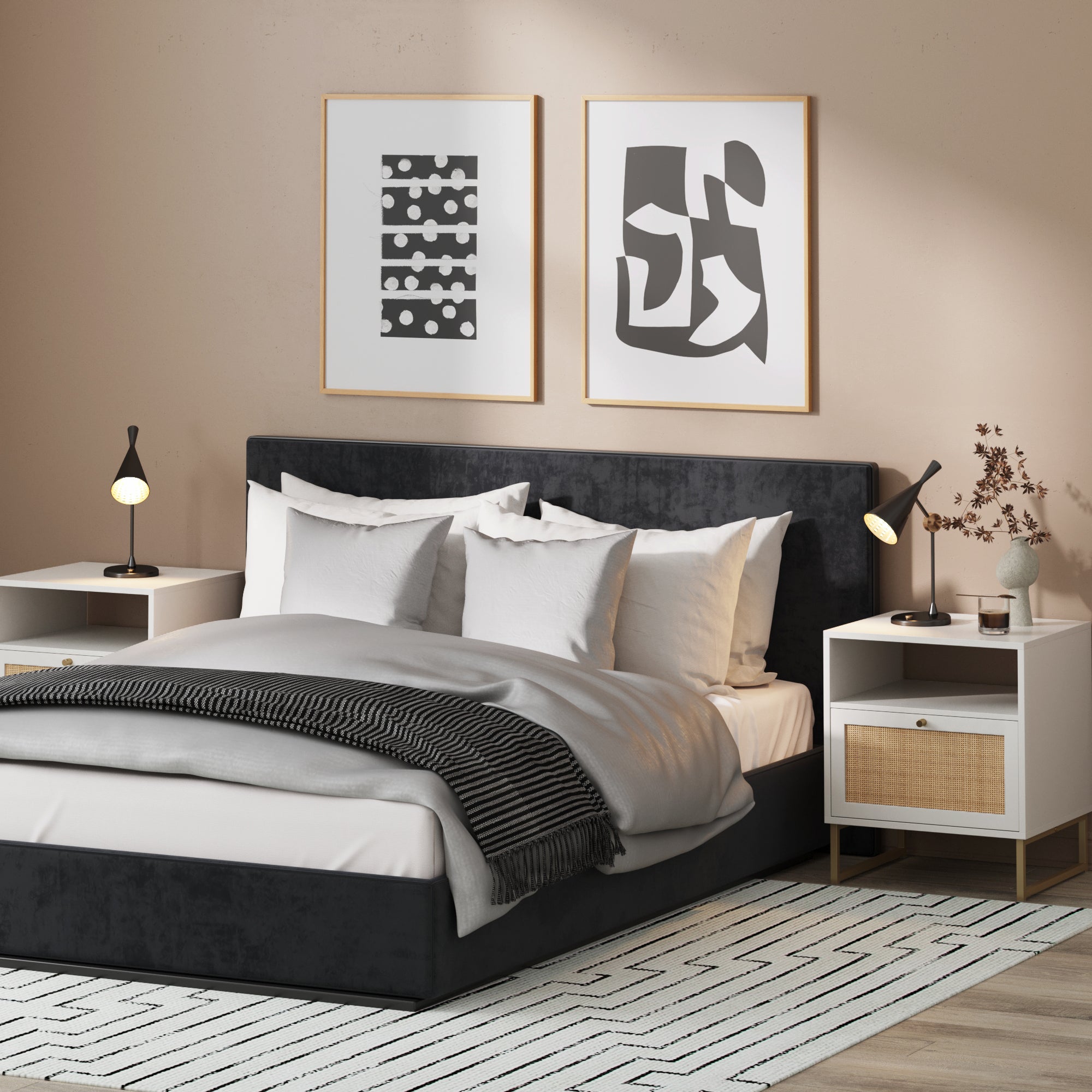 A modern bedroom with a black upholstered bed, white and gray bedding, concealed storage, two Nathan James Rattan & Wood Nightstands in white, table lamps, abstract wall art, and a patterned rug on a wooden floor.