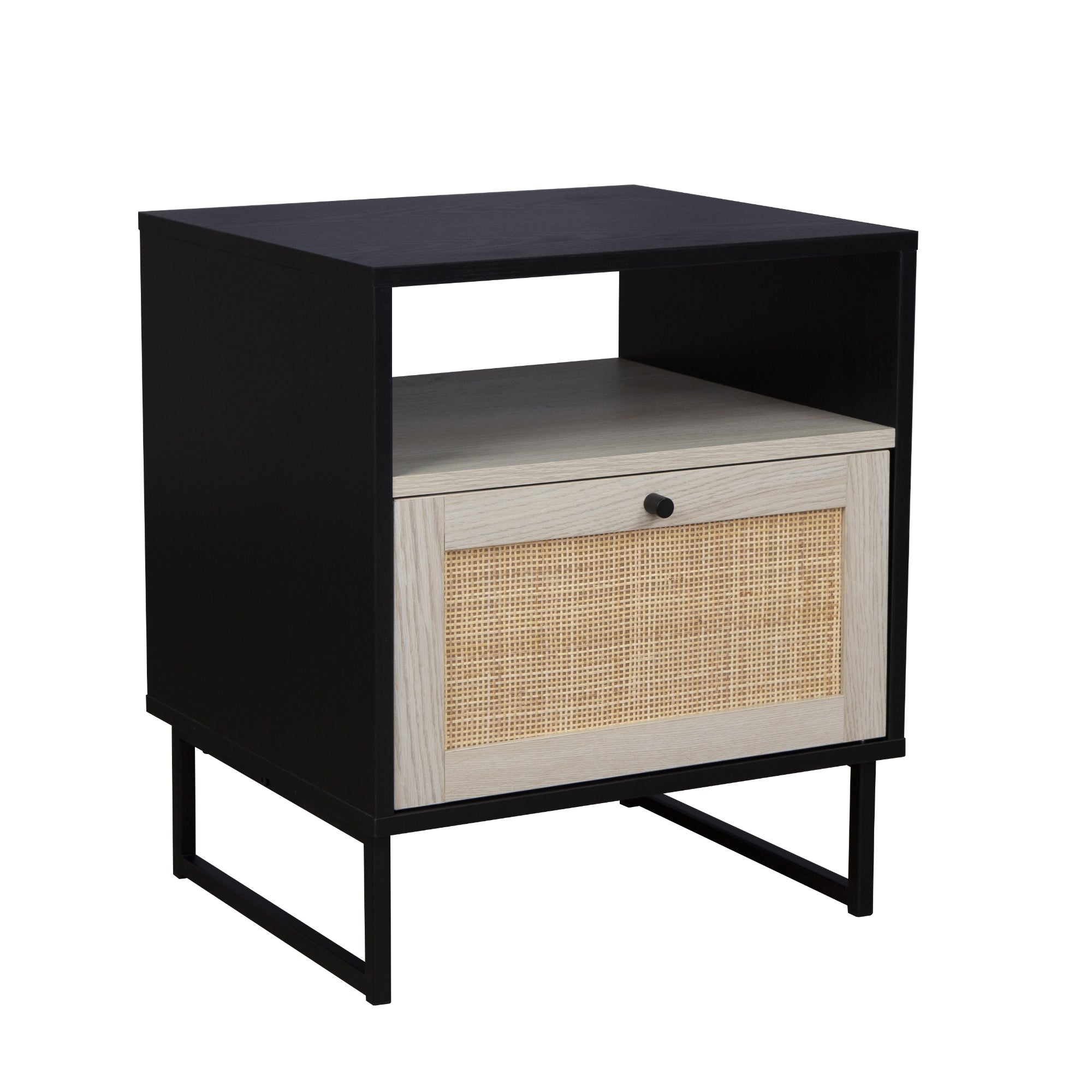 A modern nightstand with a black frame, open shelf, and a single drawer featuring a light wood front with woven rattan detail and a round black knob, set on slim black metal legs.