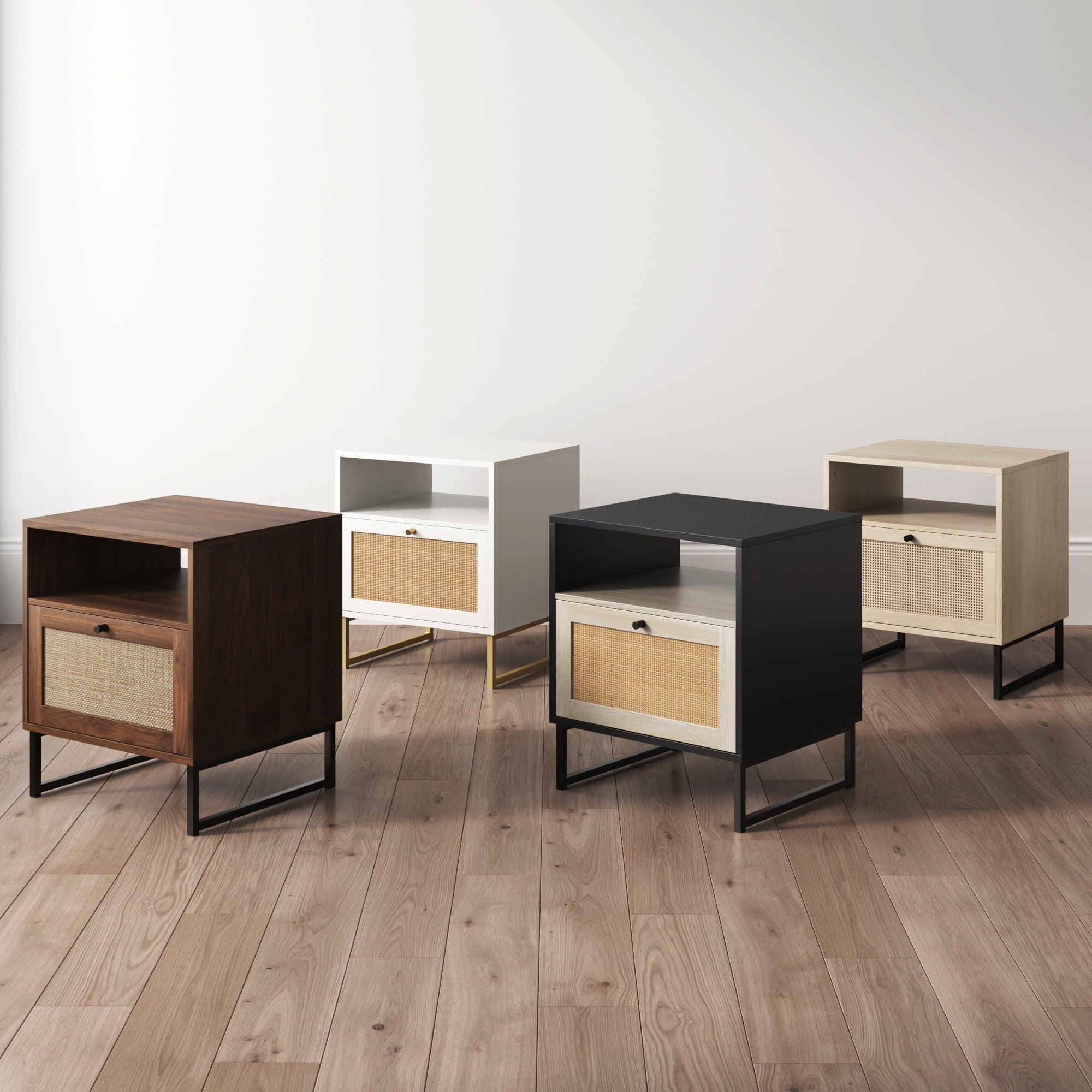 Four modern nightstands in different finishes—dark brown, white, black, and light wood—each with a drawer and open shelf, stand on a wooden floor against a plain white wall.