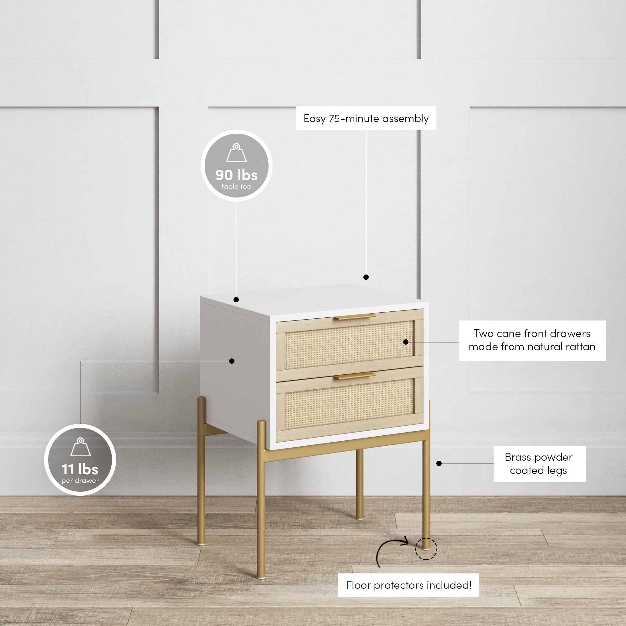 A small white and rattan nightstand with brass legs is shown in a minimal room. Labels highlight its 90 lb tabletop weight limit, 11 lb drawer limit, rattan drawers, brass-coated legs, easy assembly, and included floor protectors.