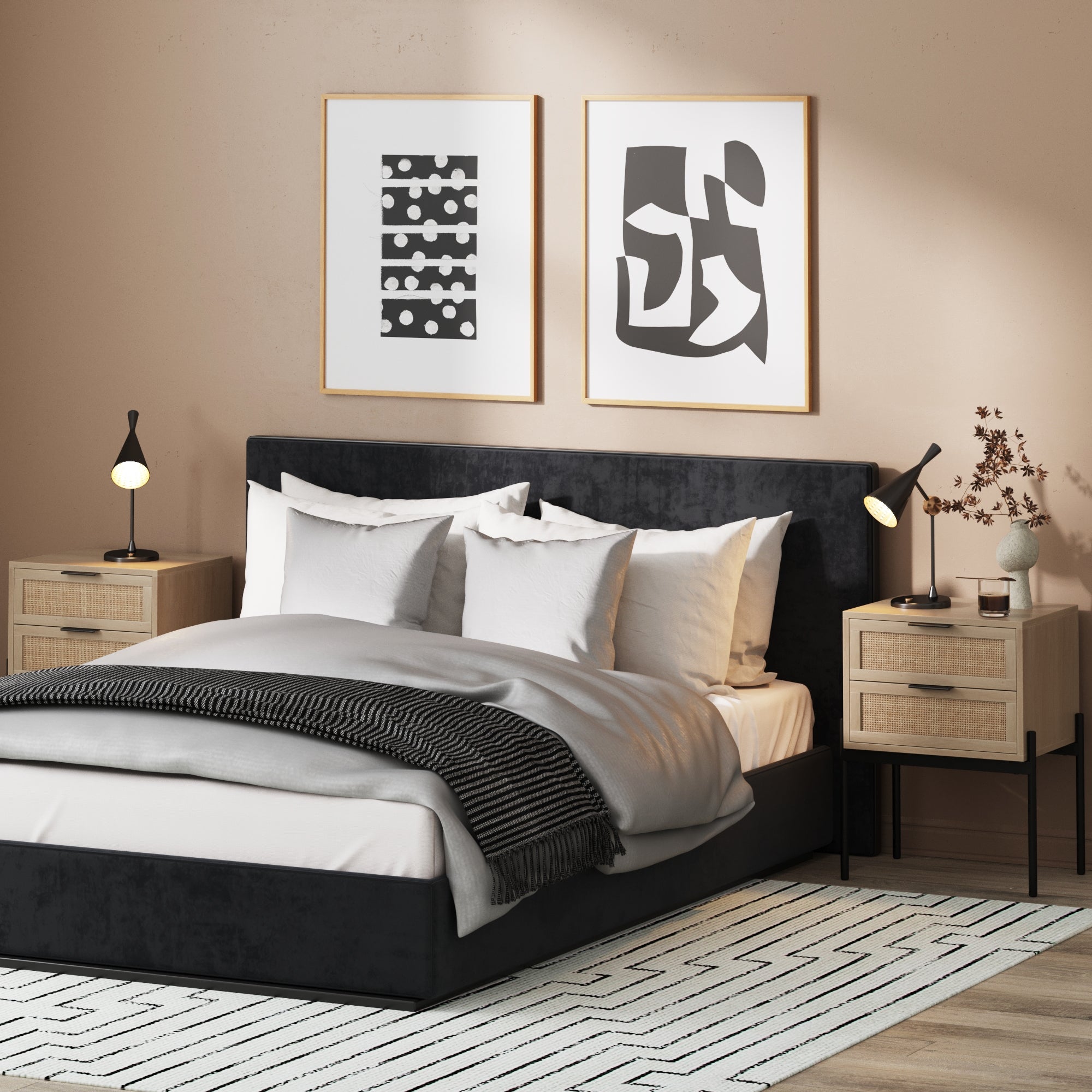 A modern bedroom with a black upholstered bed, white and gray bedding, two wooden nightstands with black lamps, abstract art above the bed, and a geometric patterned rug on the floor.