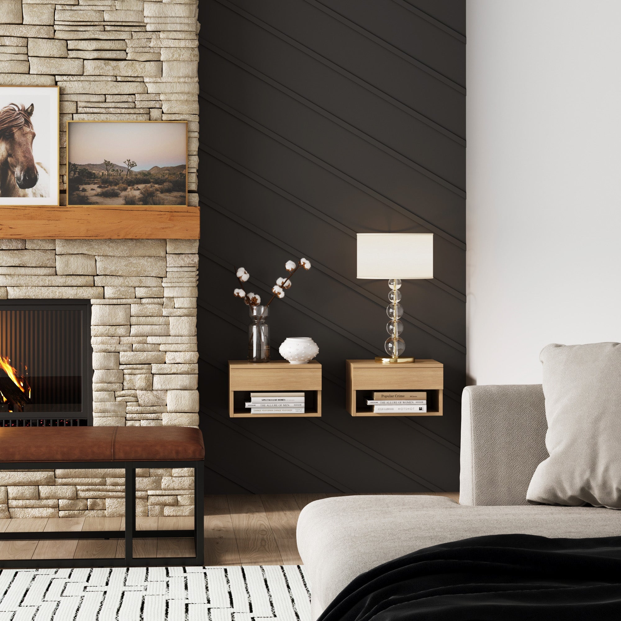 A modern living room features a stone fireplace with a wooden mantle displaying framed art, two Nathan James Mid-Century Floating Nightstands in light oak, a lamp, and a beige sofa set against a dark accent wall.