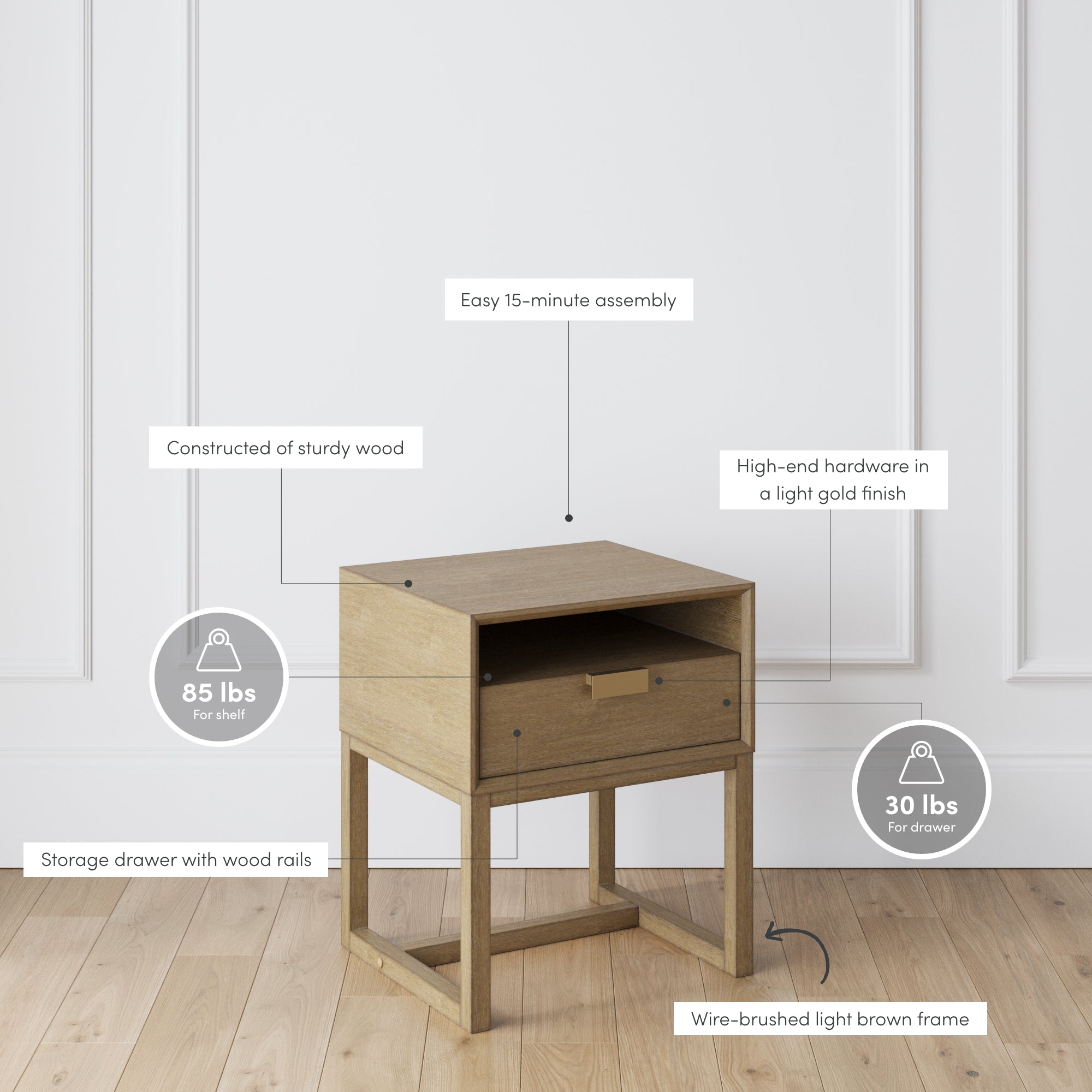 A small wooden nightstand with a drawer and open shelf, placed on a light wood floor against a white wall. Labeled features highlight its sturdy wood, gold hardware, easy assembly, and weight capacities.