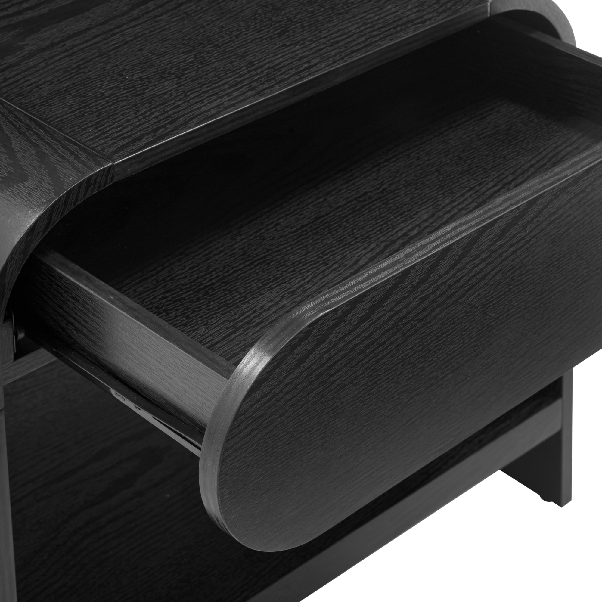 Close-up of a modern, dark wood desk or table with an open, curved drawer showing its smooth finish and visible wood grain texture.