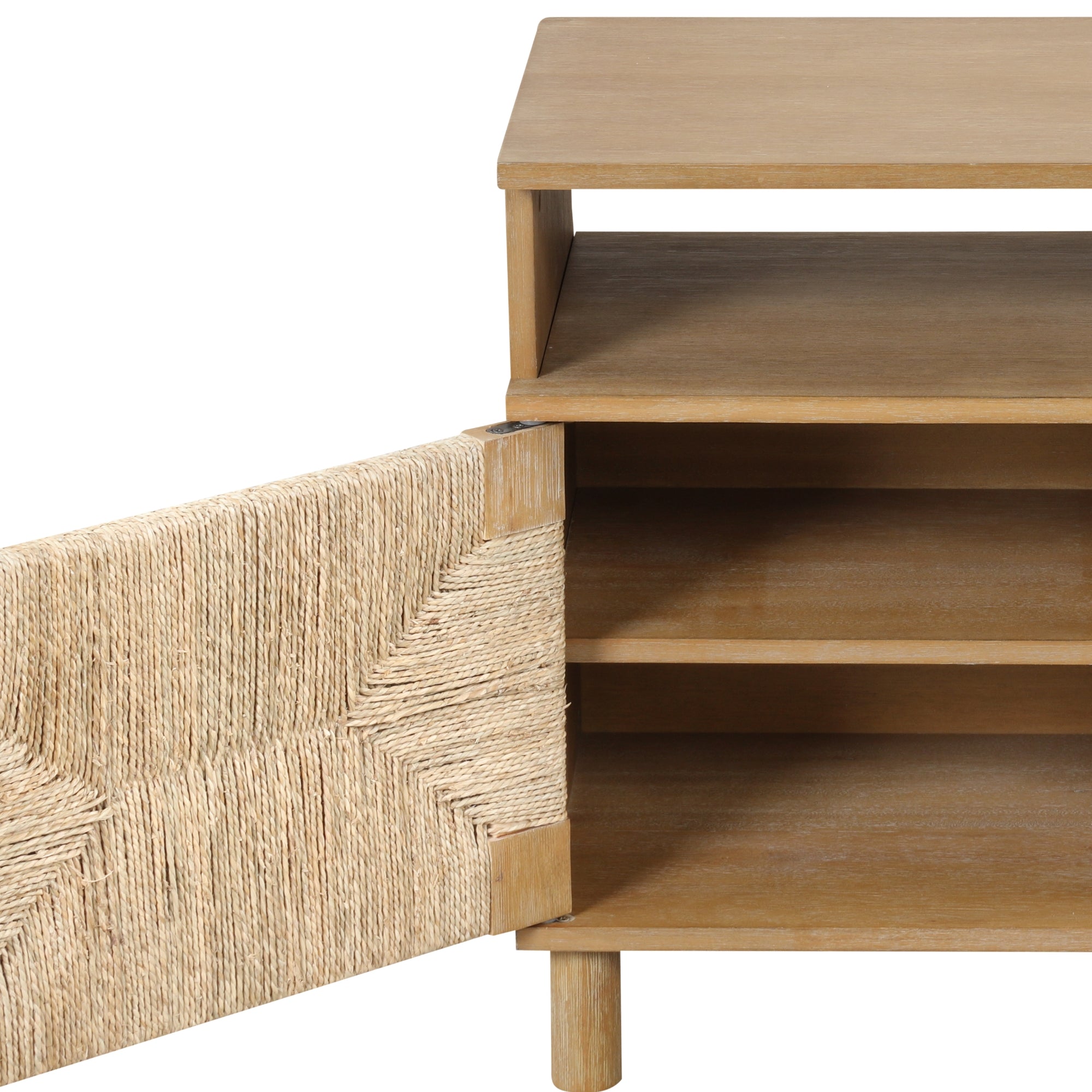 A wooden cabinet with an open woven door, revealing two shelves inside. The door features a textured pattern made of natural fibers.