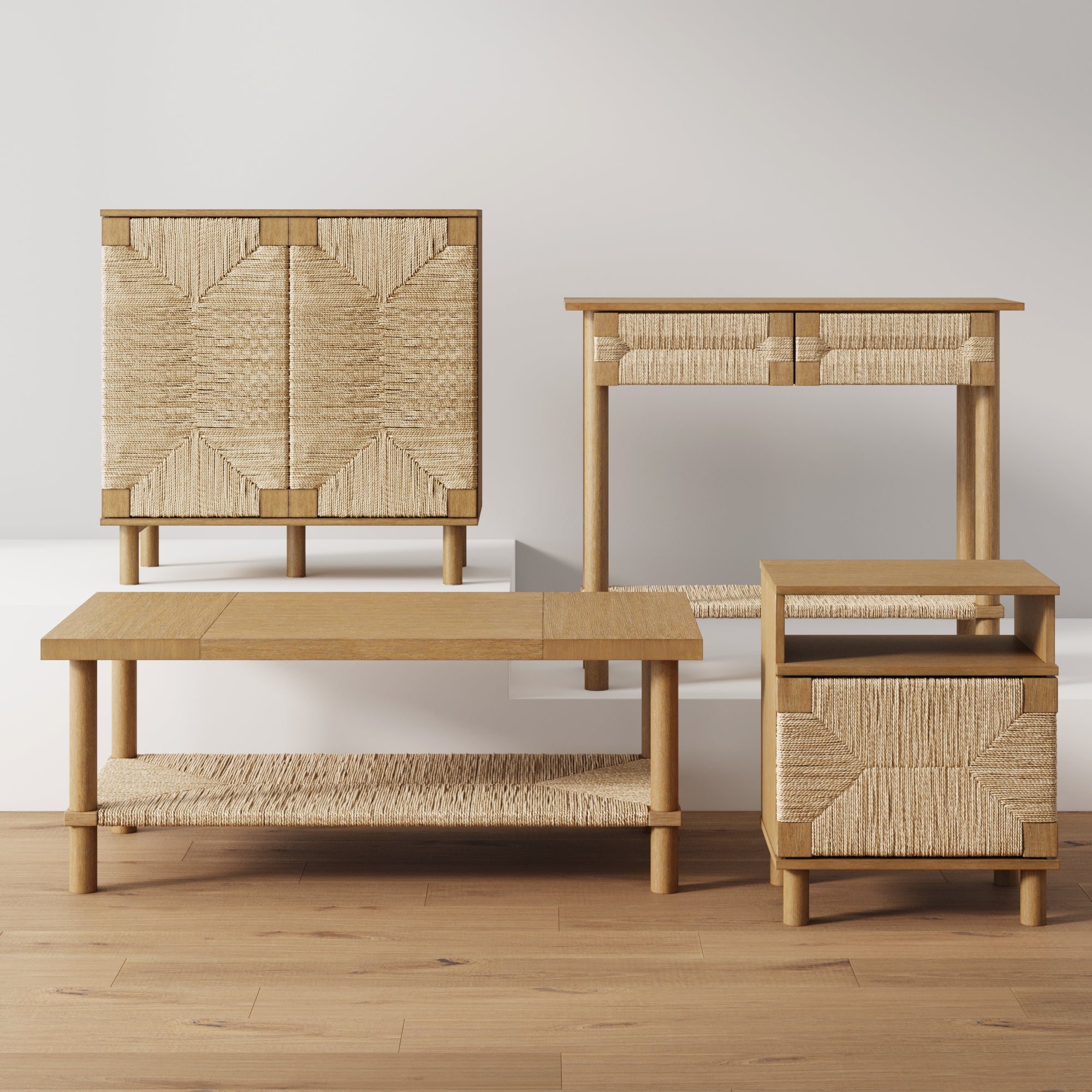Four pieces of wooden furniture with woven panel accents, including a cabinet, a desk, a coffee table, and a side table, are arranged on a light wood floor against a plain white wall.