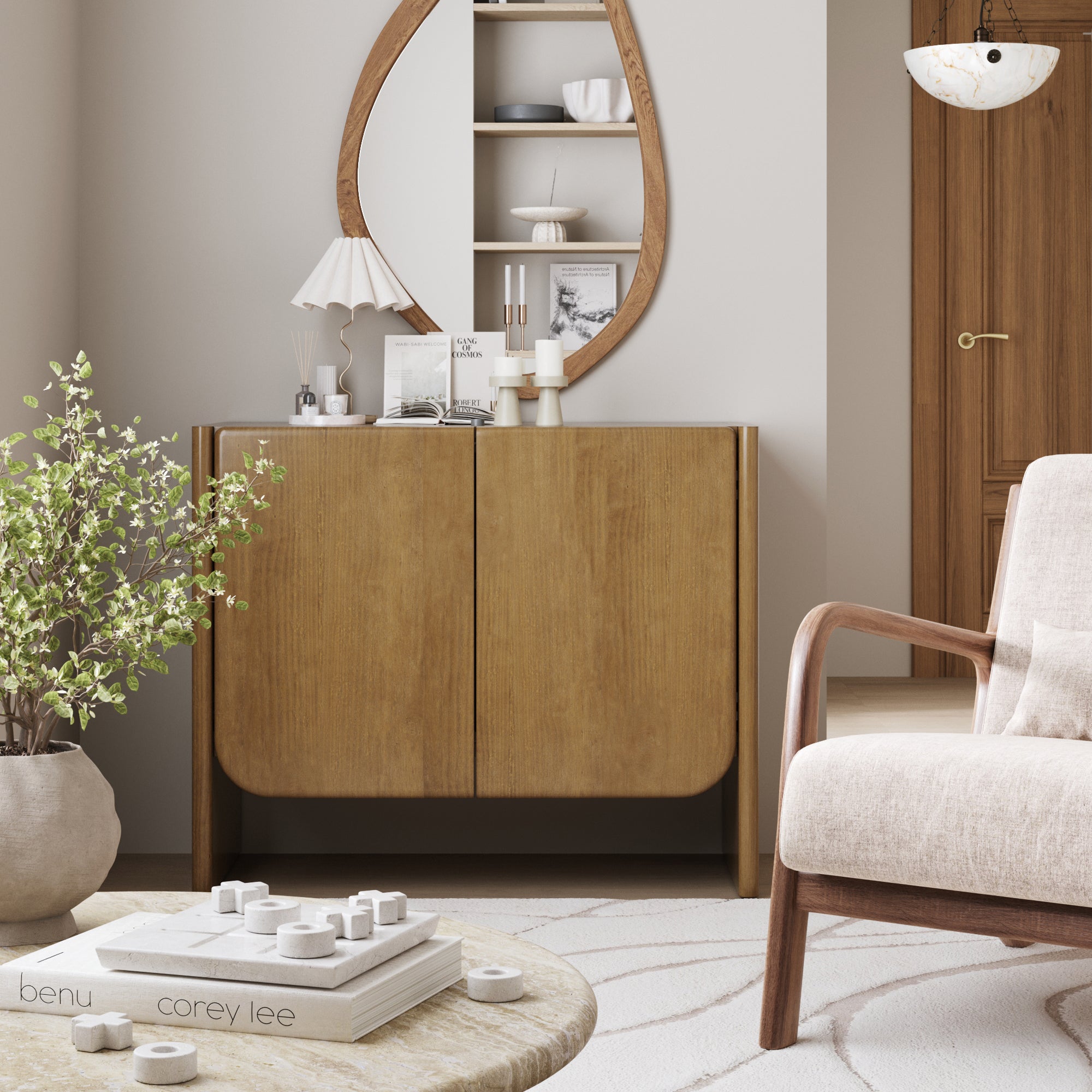 A modern living room with the Nathan James Mid Century Modern Arch Storage Cabinet in light brown, adjustable shelf, asymmetrical mirror, potted plant, round coffee table with books and decor, light armchair, and neutral walls for a cozy minimalist vibe.