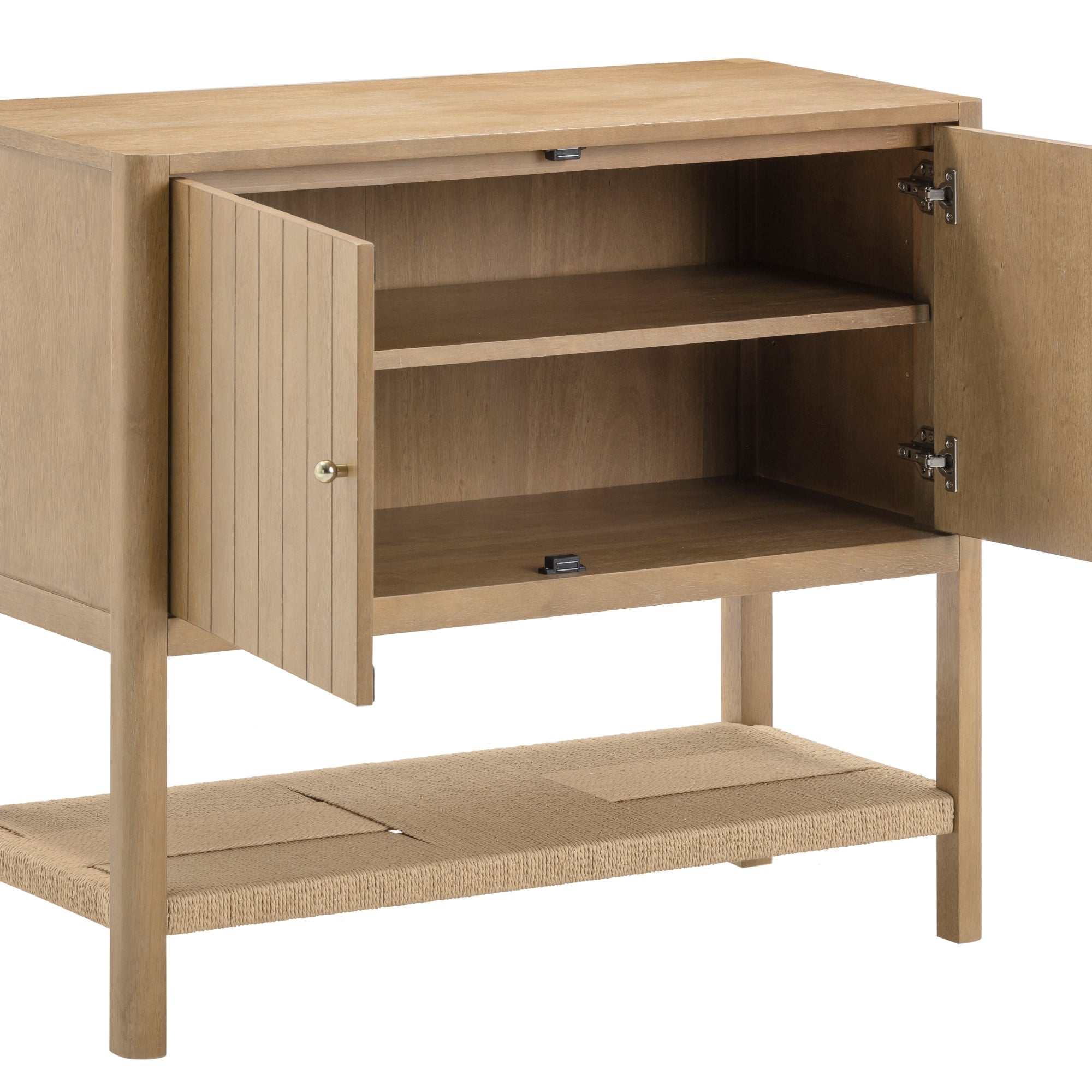 Light wood cabinet with two open doors, revealing an internal shelf. The cabinet stands on four legs and has an additional woven shelf at the bottom. The design is simple and modern.