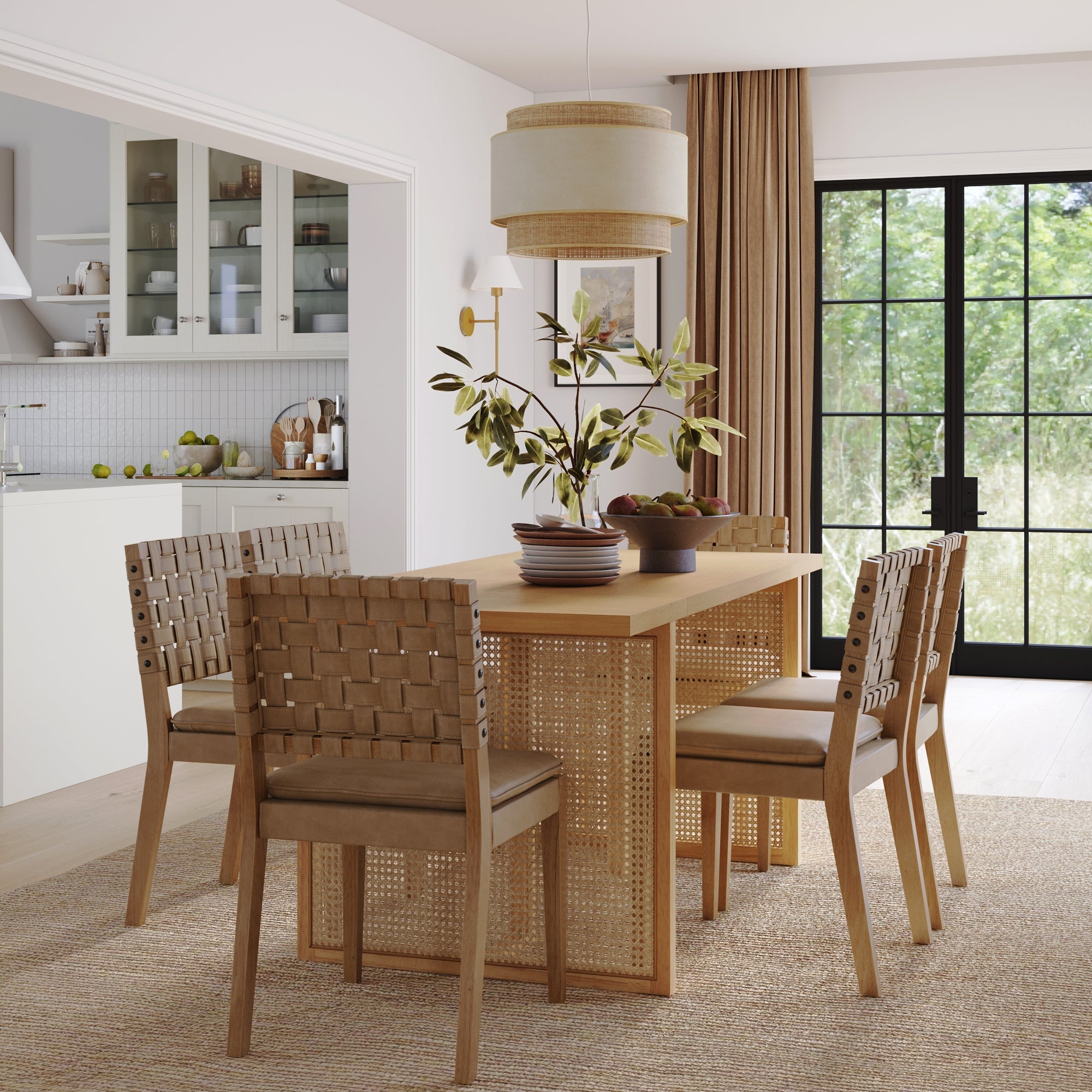 A modern dining room featuring the Nathan James Woven Faux Leather & Rattan Dining Set (6 Chairs), a solid wood table, green branch centerpiece, pendant lighting, large windows with beige curtains, and a view into a white kitchen.