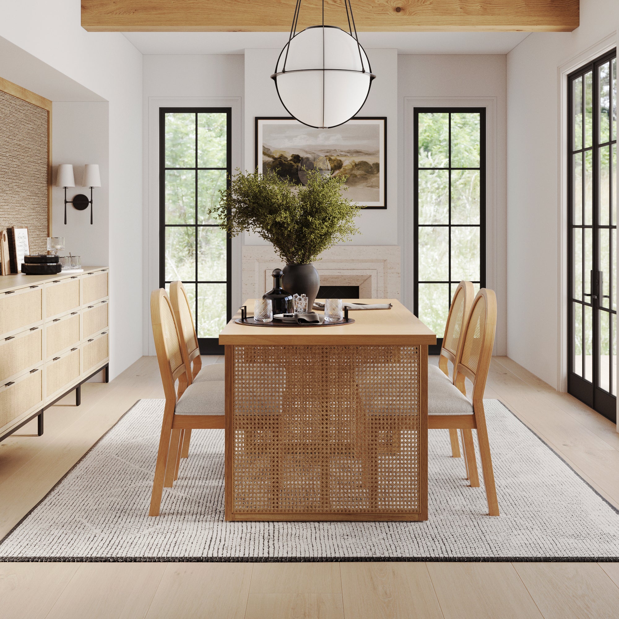 A modern dining room with light wood furniture, four chairs around a rectangular table, a large pendant light, a white rug, a sideboard, and large windows letting in natural light. A green plant sits in a vase on the table.