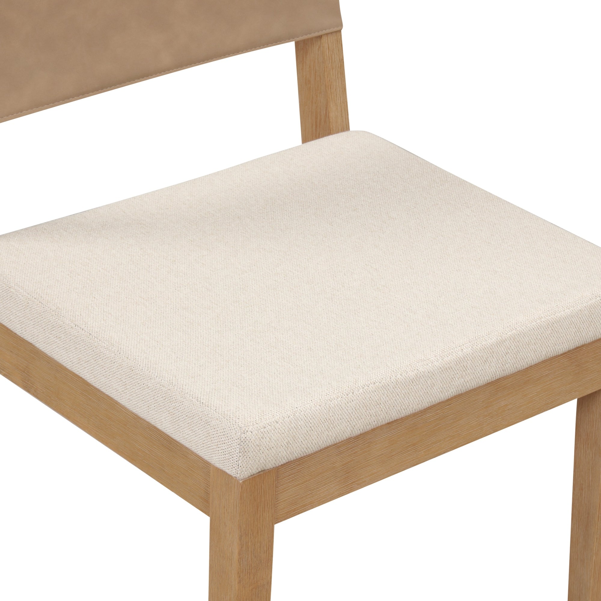 A close-up view of a wooden chair with a light-colored cushioned seat and a partially visible tan backrest. The chair has simple, clean lines and a minimalist design.