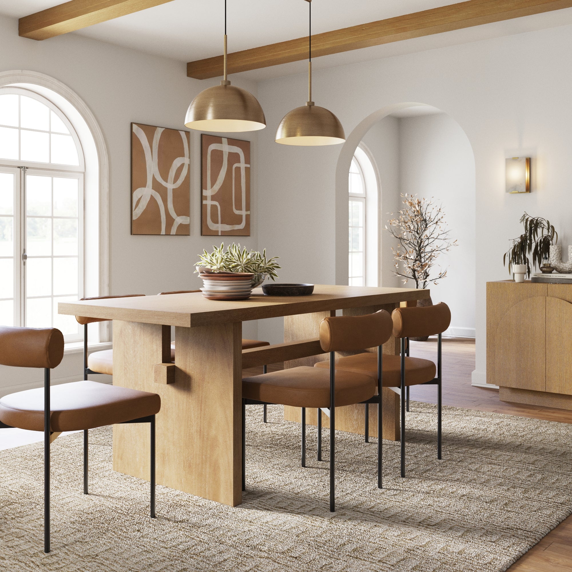 A modern dining room with a wooden table, six leather chairs, abstract art on the wall, two pendant lights, arched windows, and neutral decor with plants. Natural light fills the space, highlighting the cozy atmosphere.