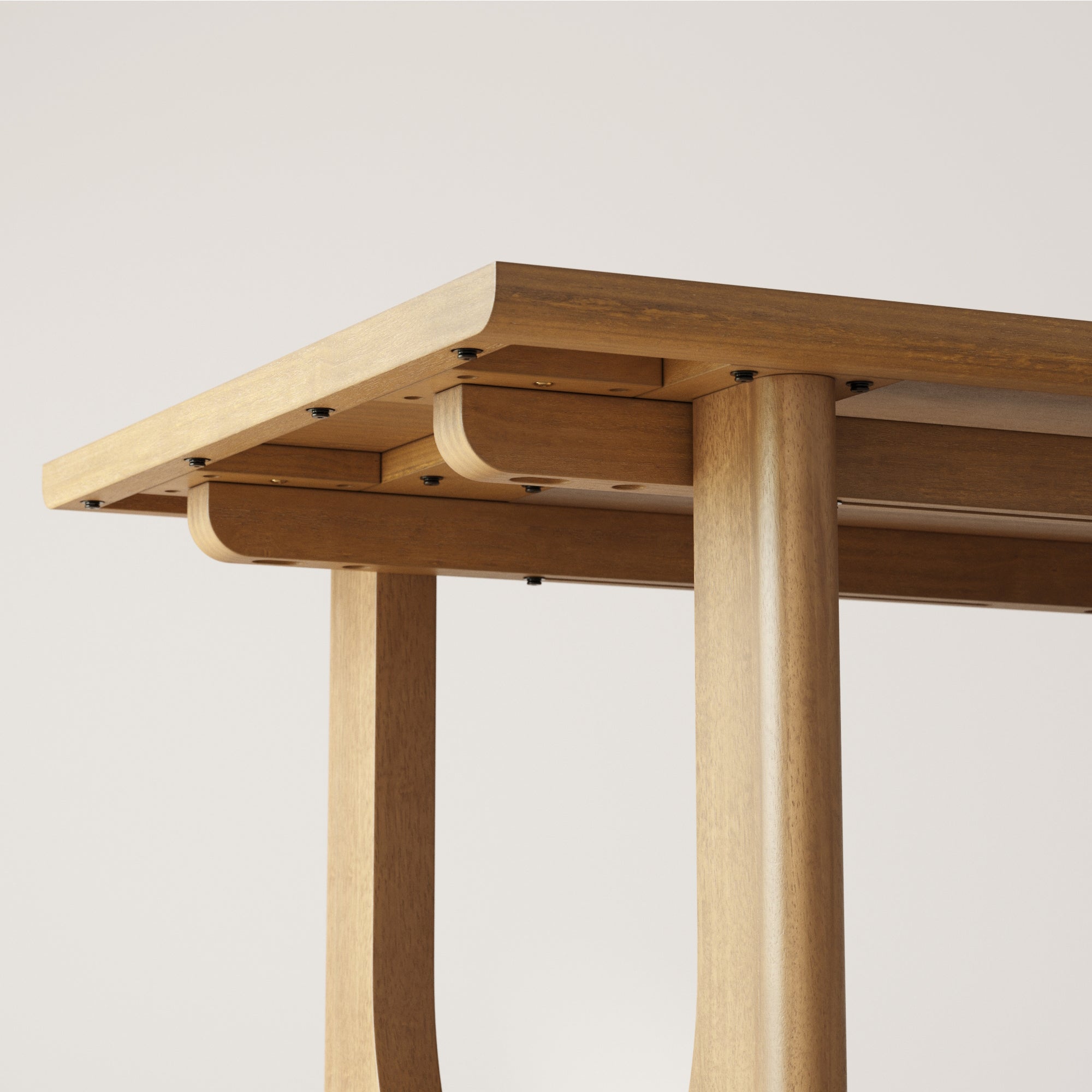 Close-up view of the underside of a wooden table, showing smooth, light wood finish, rounded edges, and sturdy, cylindrical legs with visible black screws connecting the parts.