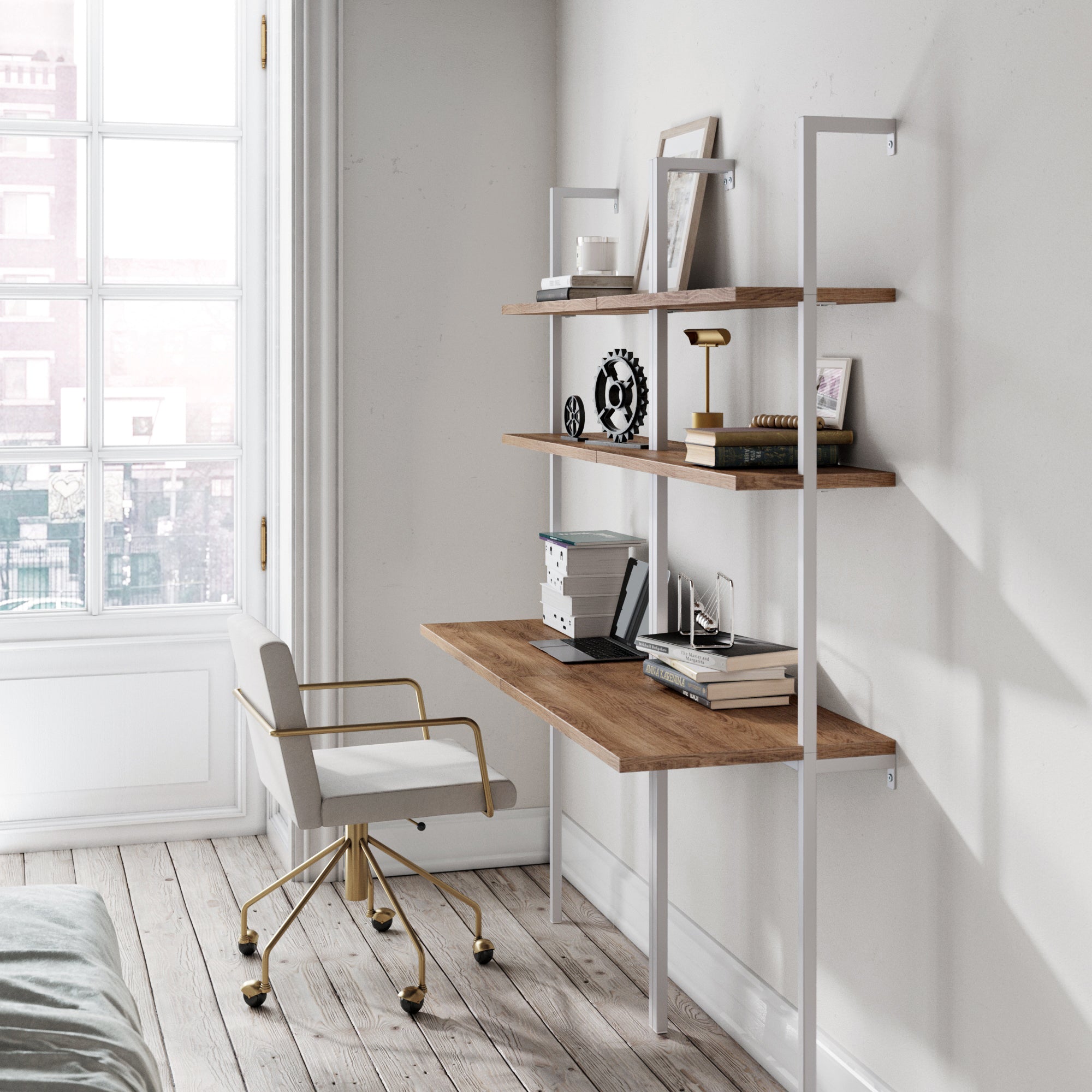 A modern home office includes two Nathan James Wood Wall Mount Ladder Desks in oak, paired with a matching chair and rustic shelves for books and decor. Large windows and light walls enhance the airy vibe over wooden floors.