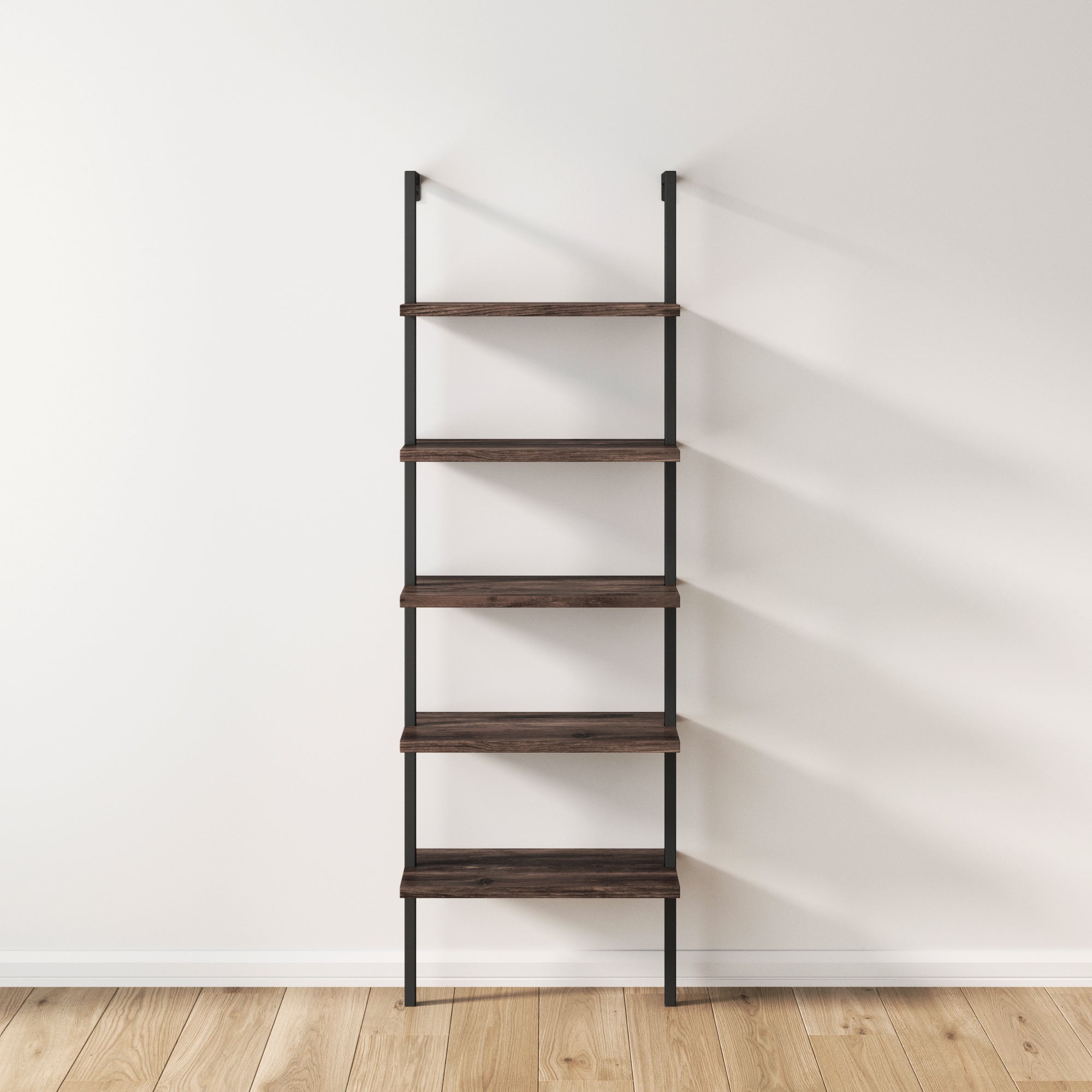 A minimalist, wall-mounted 5-Shelf Ladder Bookshelf in nutmeg and matte black by Nathan James, featuring five wooden shelves and metal supports, set against a white wall and light wood floor.