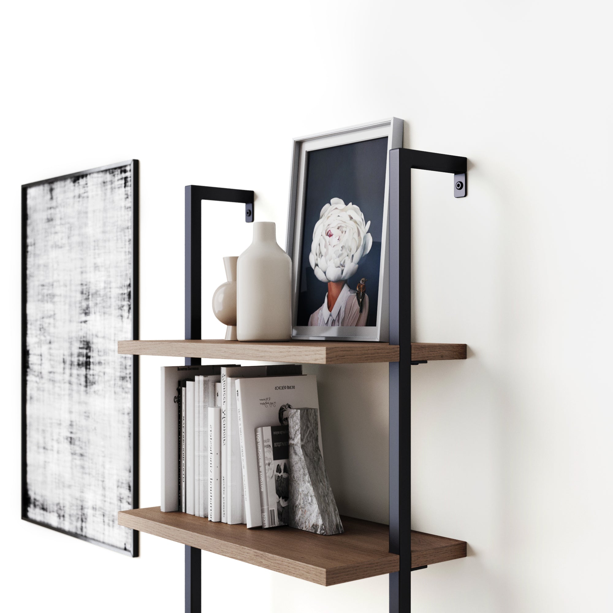 A modern wall-mounted shelf holds books, white vases, and a framed art print of a person with a flower head. A black-and-white abstract painting hangs on the white wall beside the shelf.