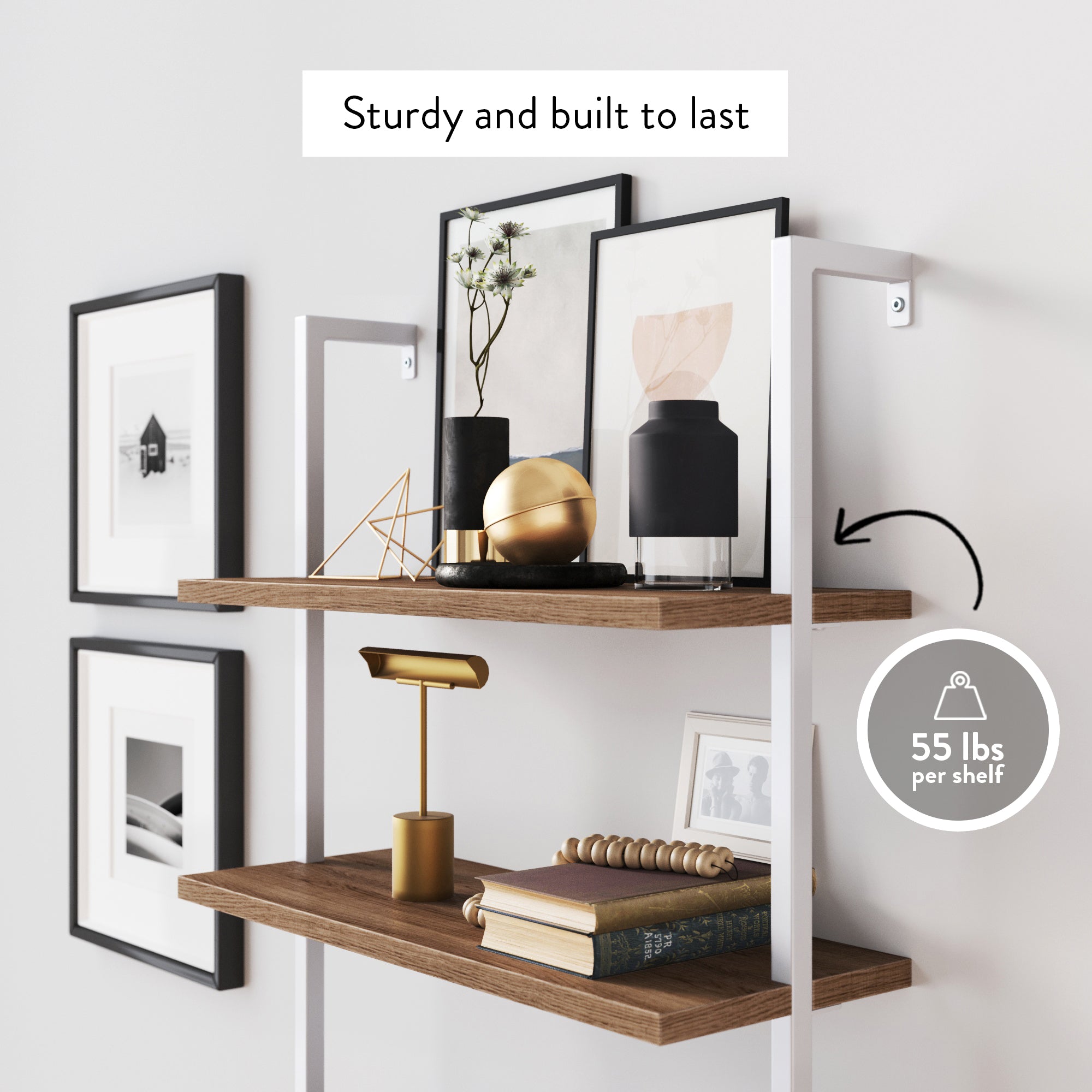 Two wooden wall shelves with white metal brackets display decor, books, and framed art. Text above reads Sturdy and built to last and a label notes 55 lbs per shelf weight limit.