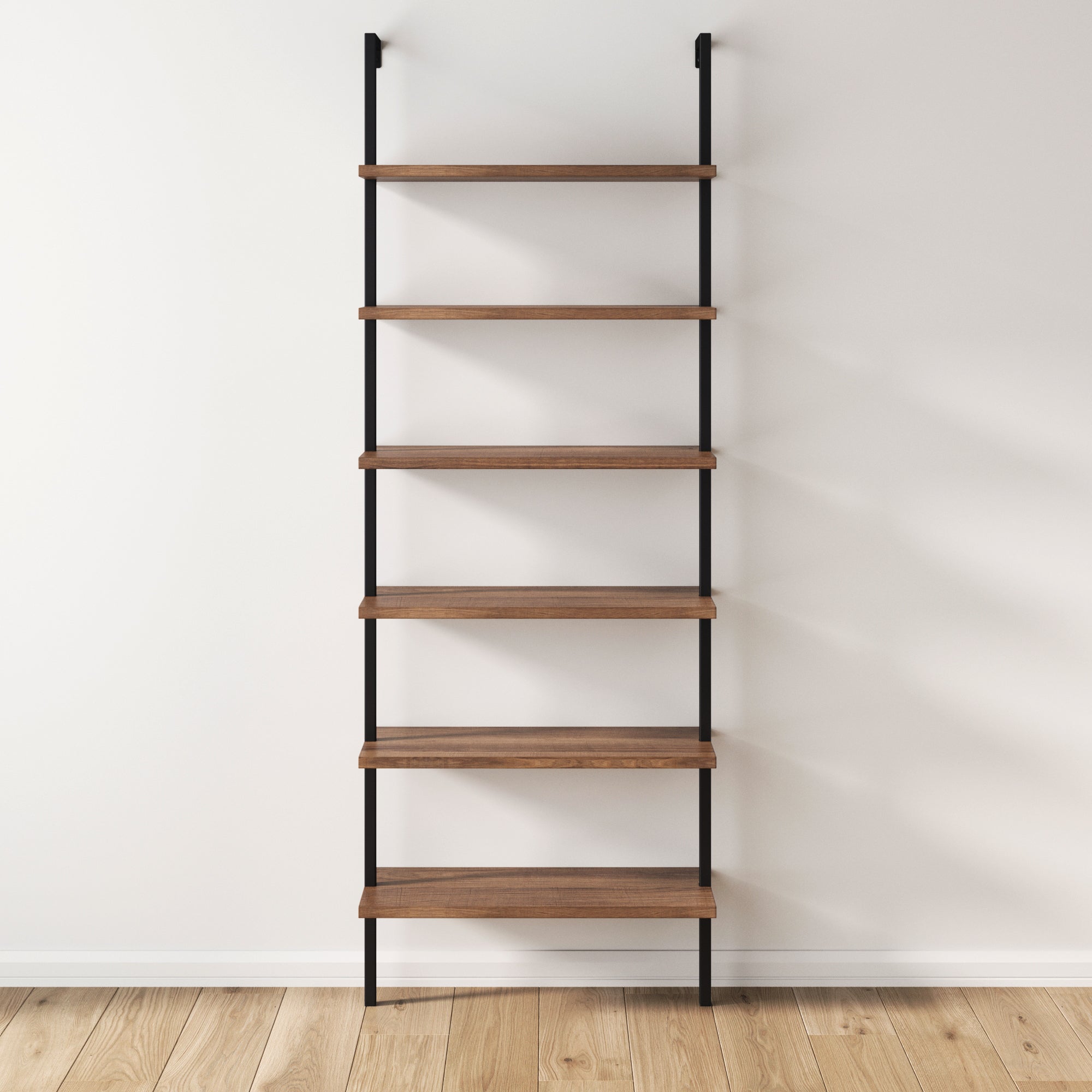 Minimalist leaning bookshelf with black metal frame and six natural wood shelves, positioned against a white wall on a light wood floor. The shelves are empty.