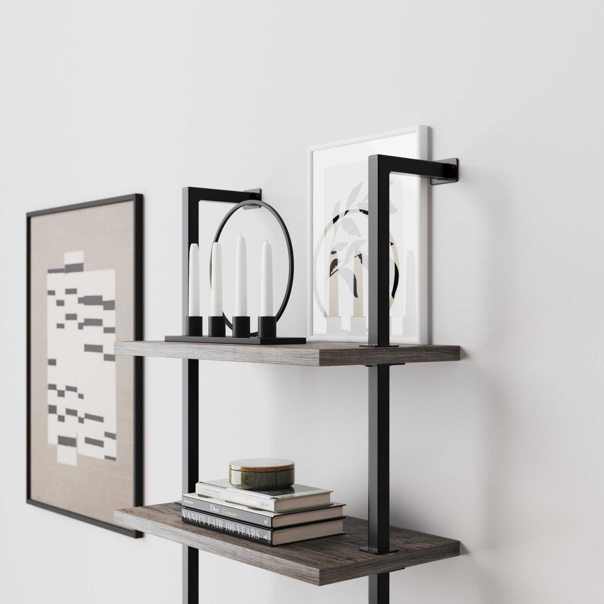 Modern wall shelves with books, framed abstract art, and a minimalist black candleholder with four white candles. The shelves and decor have a clean, contemporary design against a white wall.