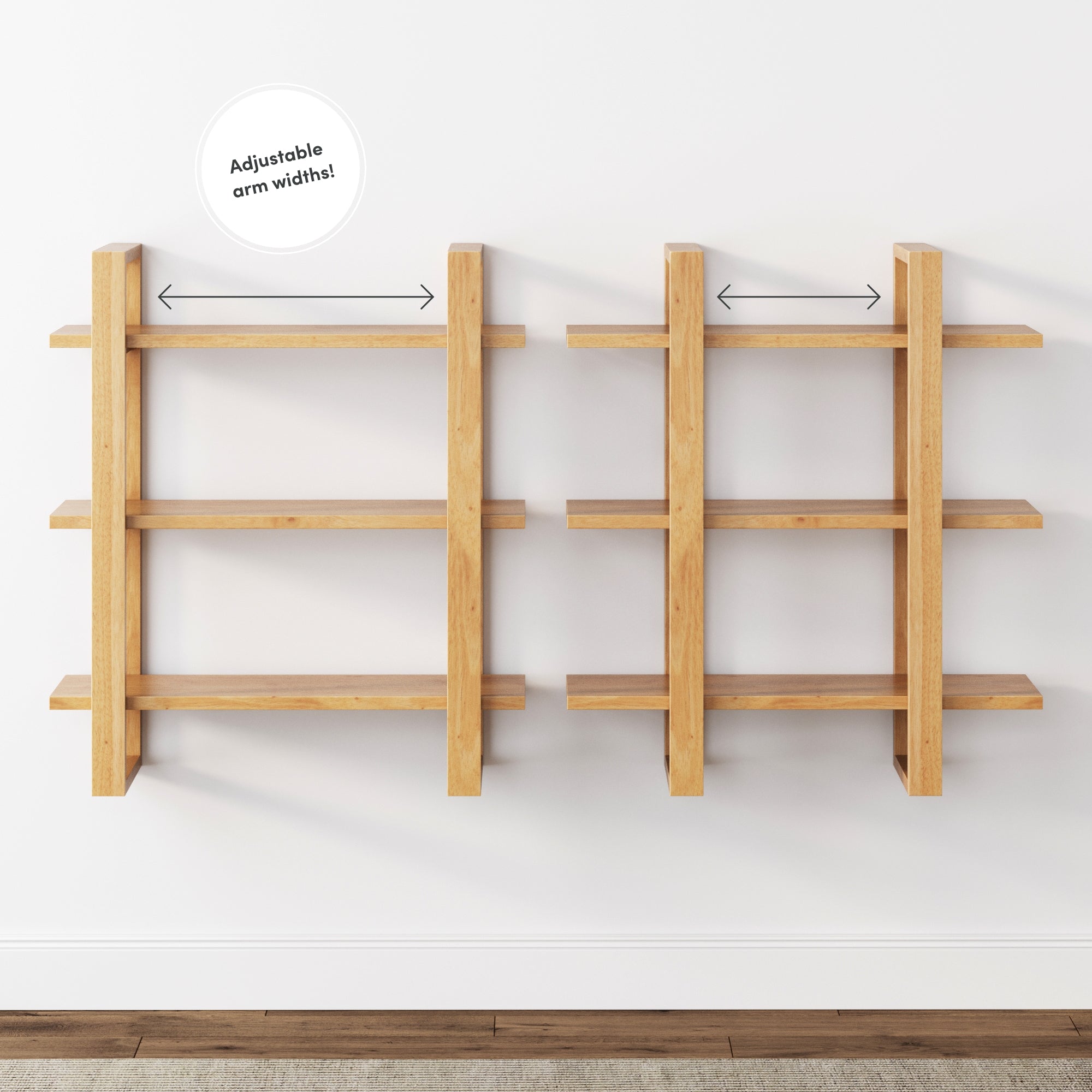 Two wooden wall-mounted shelves with three tiers each are shown against a white wall. Arrows indicate the adjustable arm widths for the shelves. The floor is wooden.