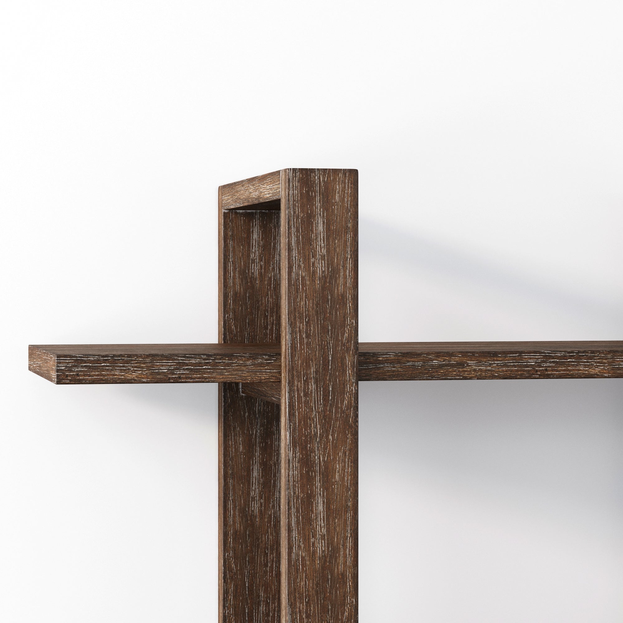 A close-up view of a modern wooden wall shelf with a vertical support intersecting a horizontal shelf, set against a plain white background. The wood has a dark, textured finish.