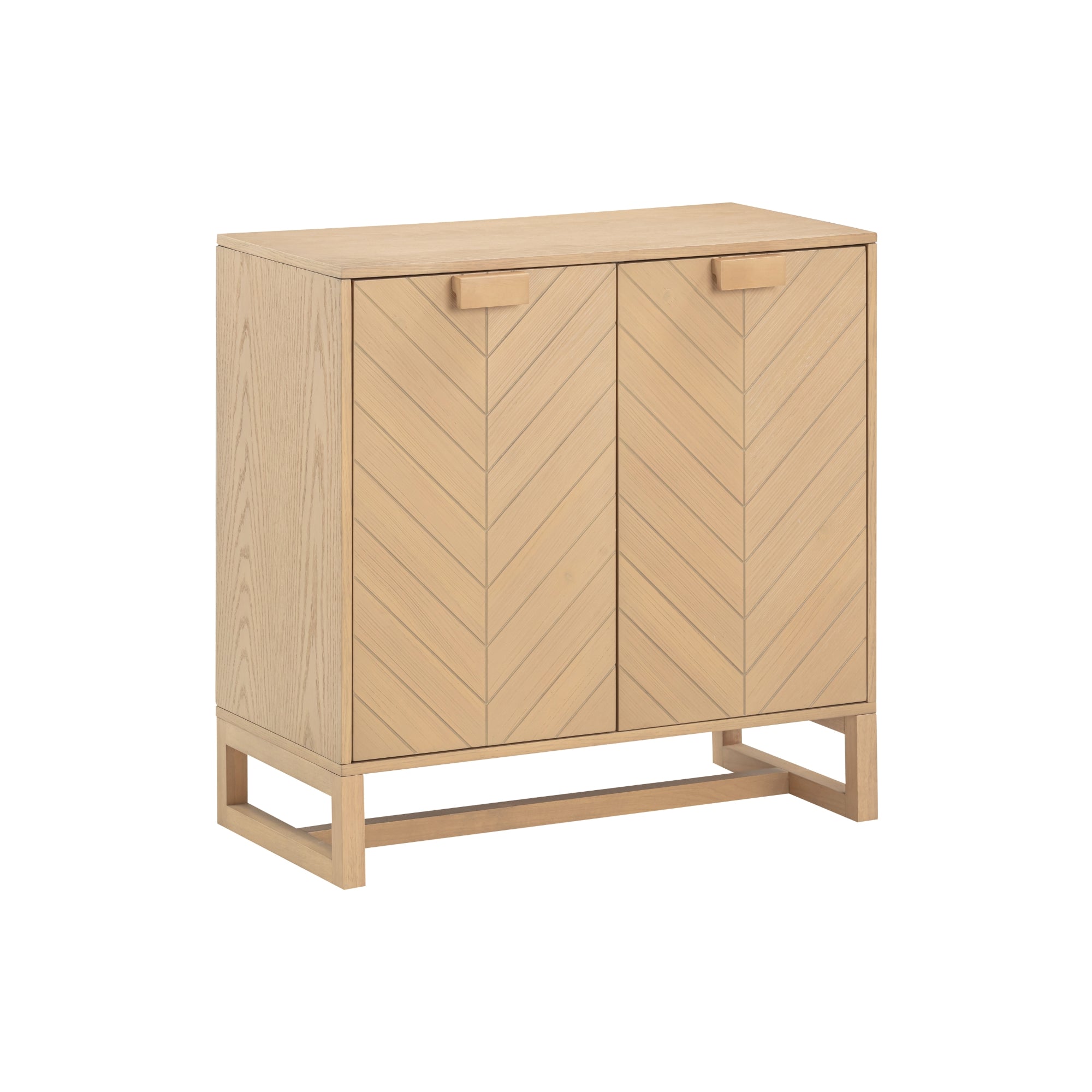 A light wood cabinet with two doors featuring a chevron pattern, rectangular handles, and an open rectangular base, photographed against a plain white background.