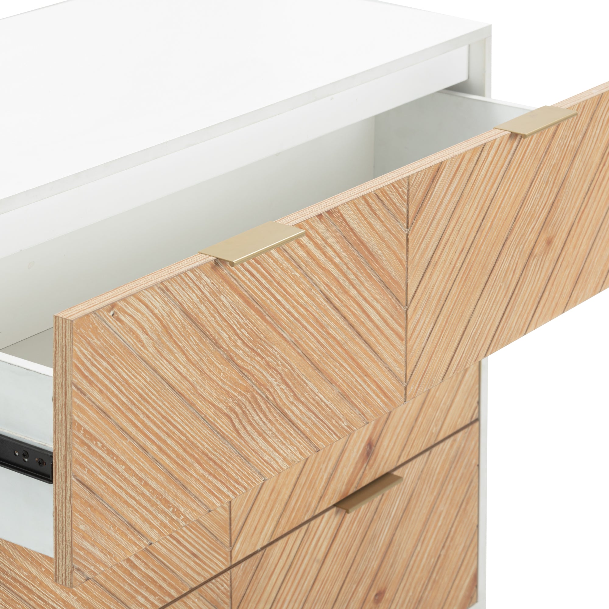 A wooden dresser with a white top and a partially open drawer. The drawer front has a chevron-patterned wood design and a rectangular brass handle. Other closed drawers are visible below.