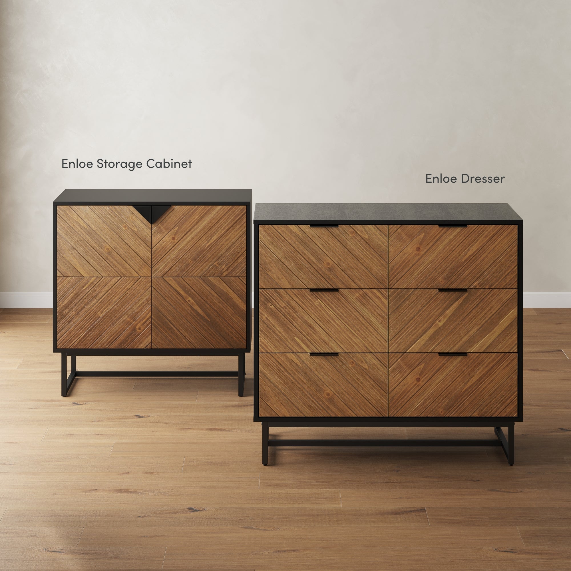 Two wooden furniture pieces—a smaller Enloe Storage Cabinet and a larger Enloe Dresser—stand on a light wood floor. Both feature a chevron wood pattern and black metal frames against a light-colored wall.
