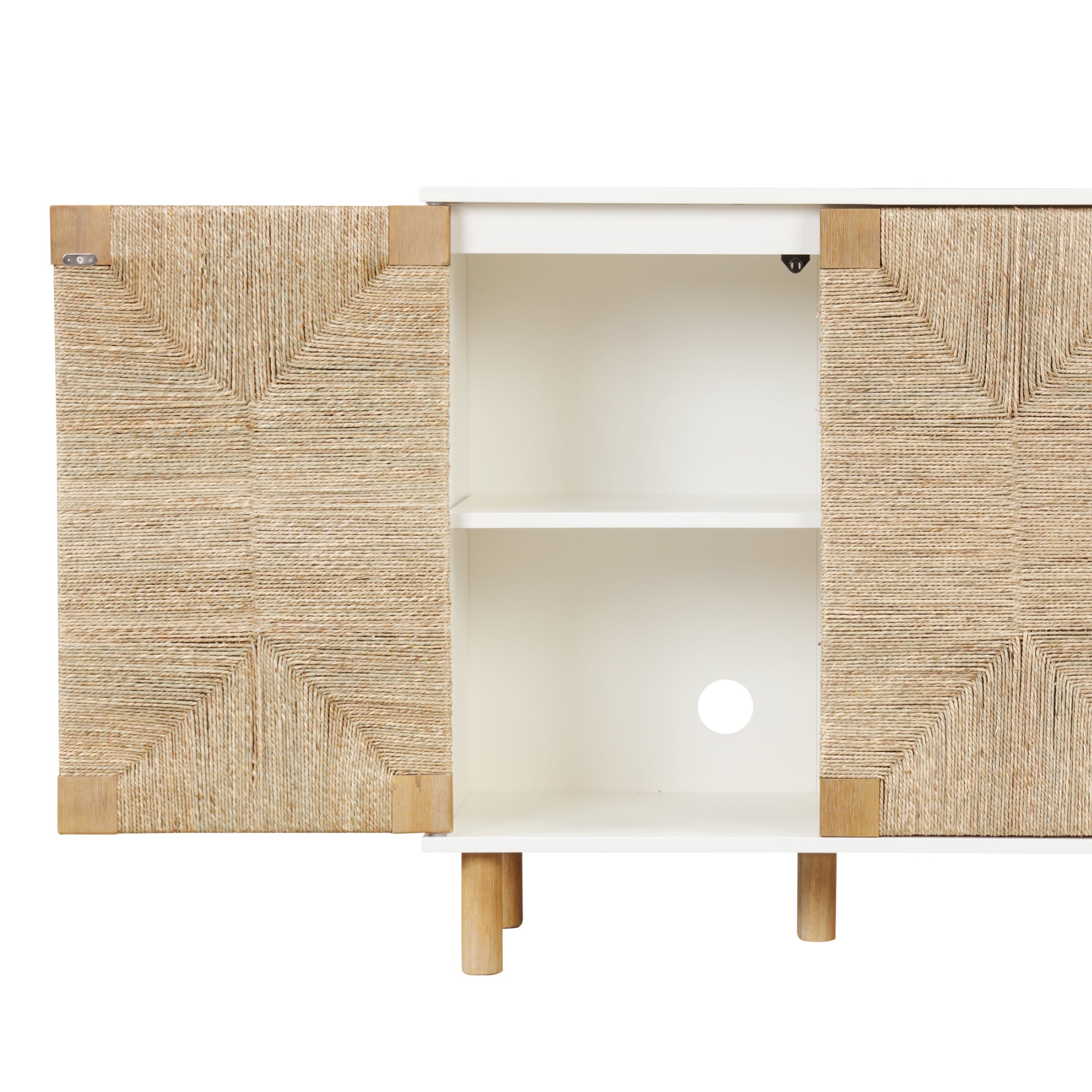 A white cabinet with wooden legs and two open doors featuring a woven, textured design. Inside, there is a single shelf and a circular cutout at the back for cable management.