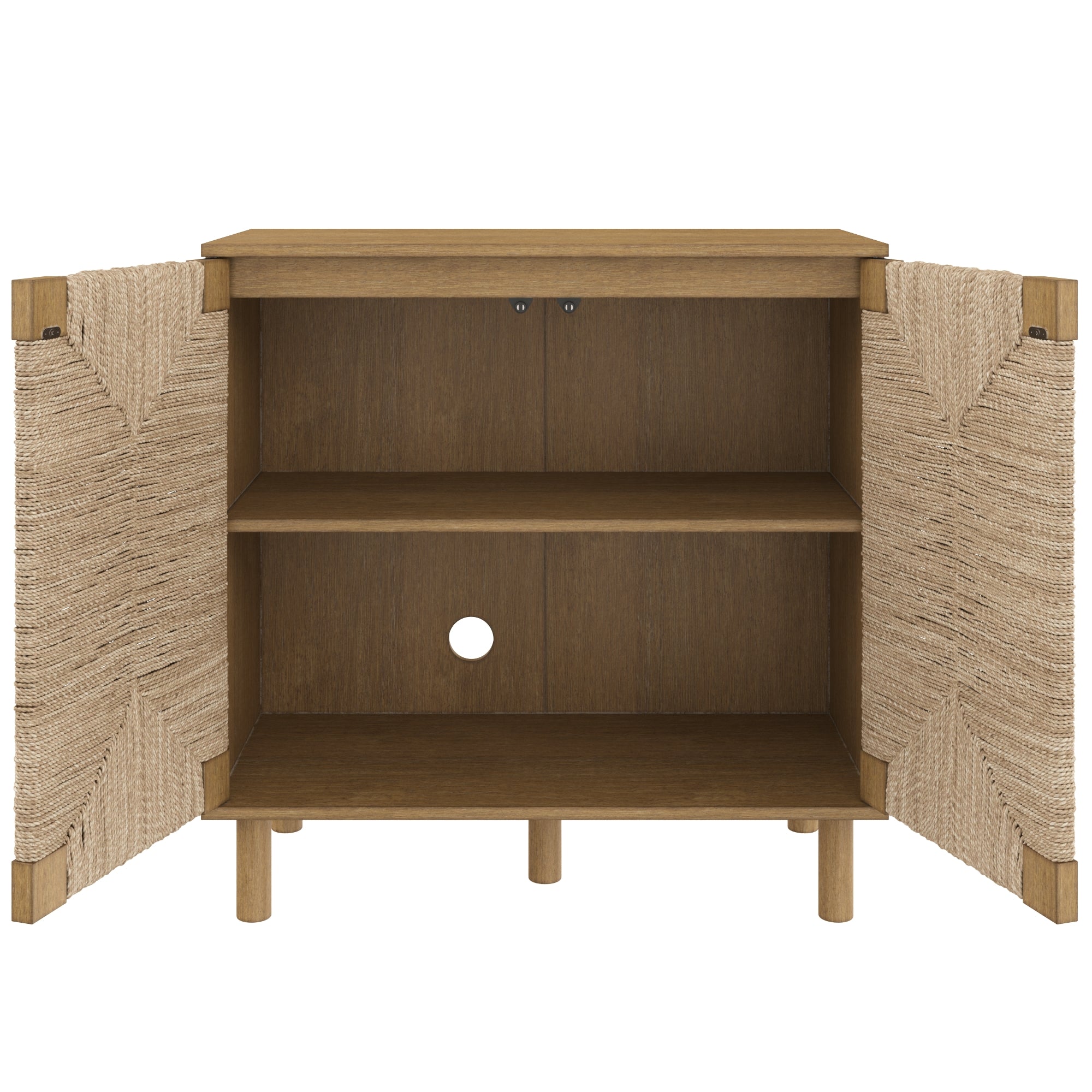 A wooden cabinet with two woven doors open, revealing two interior shelves and a circular cable management hole in the back panel. The cabinet has a natural wood finish and round legs.