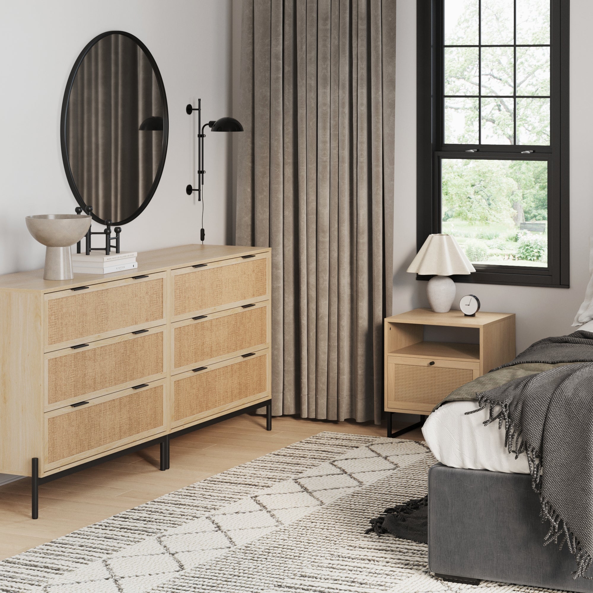 A cozy bedroom features the Nathan James Boho Rattan Cabinet Bedroom Set in light oak, paired with gray curtains, a patterned rug, and a neatly made bed for a modern touch.