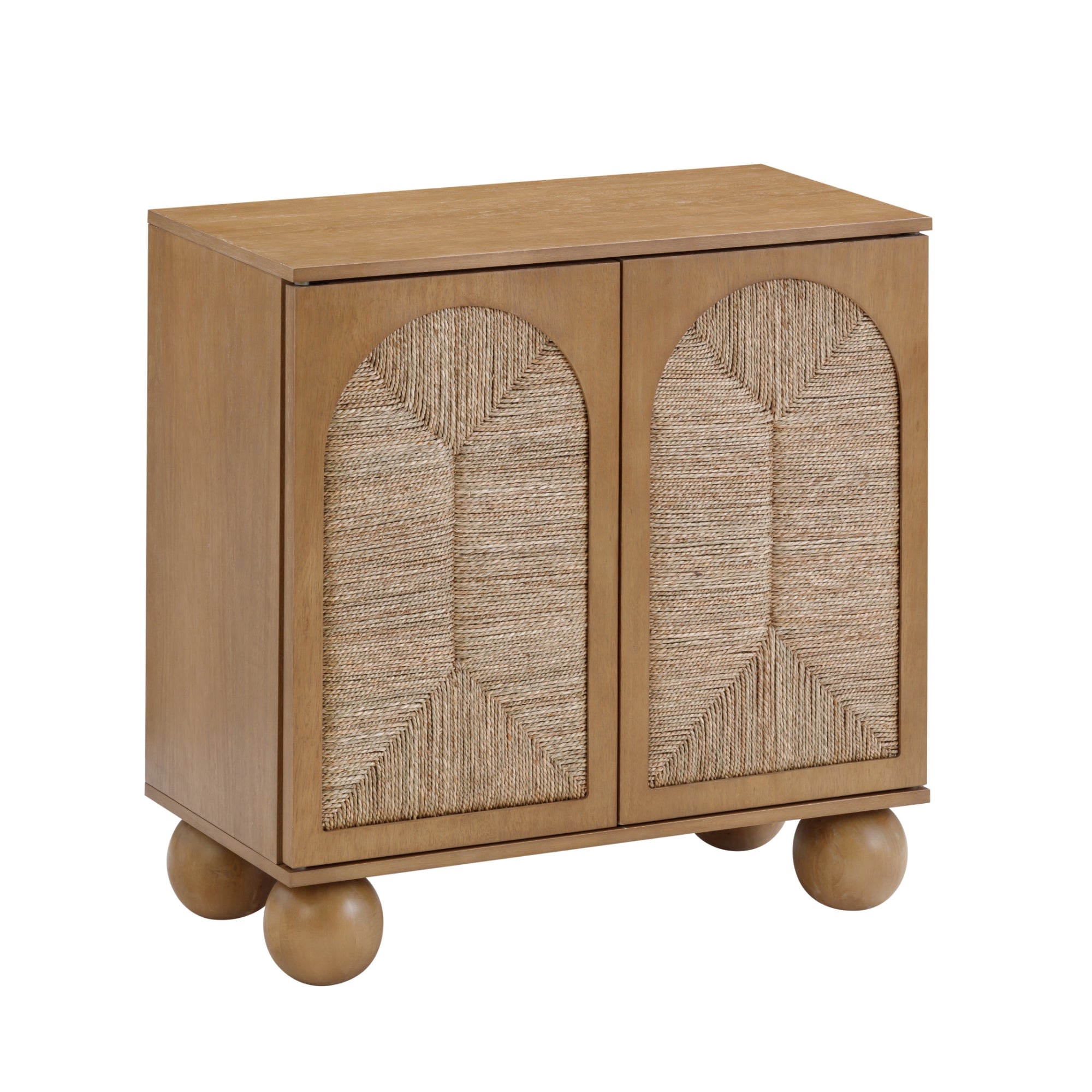 A small wooden cabinet with two doors featuring woven rattan panels in a geometric pattern. The cabinet has four round ball-shaped legs and a light brown finish.