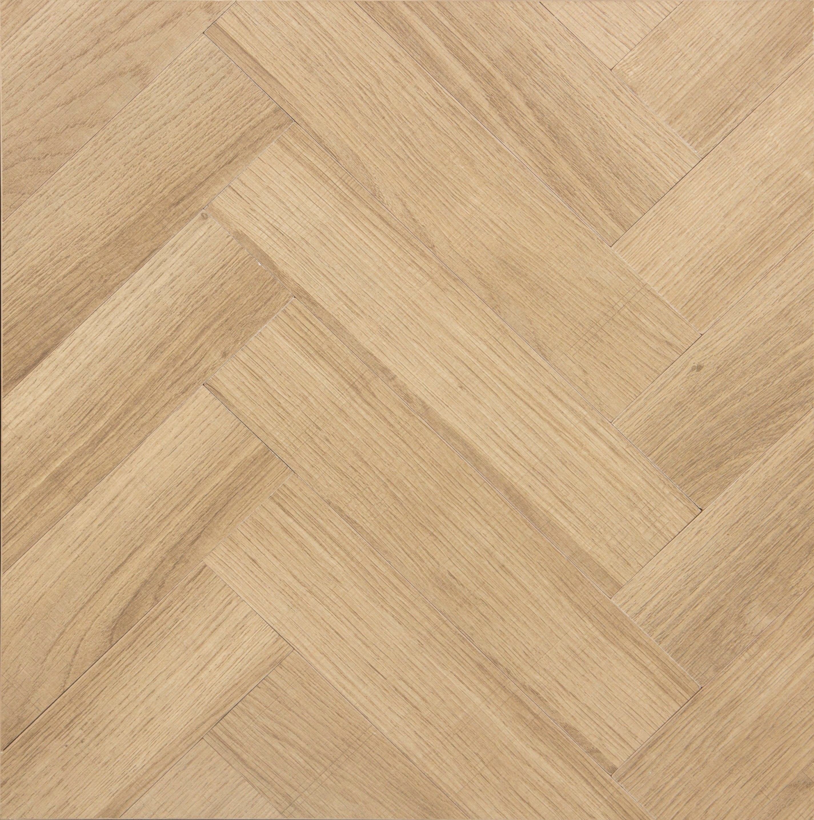Light brown wooden floor with a herringbone pattern, showing rectangular planks arranged diagonally in a repeating zigzag design. The surface has a smooth texture and natural wood grain.