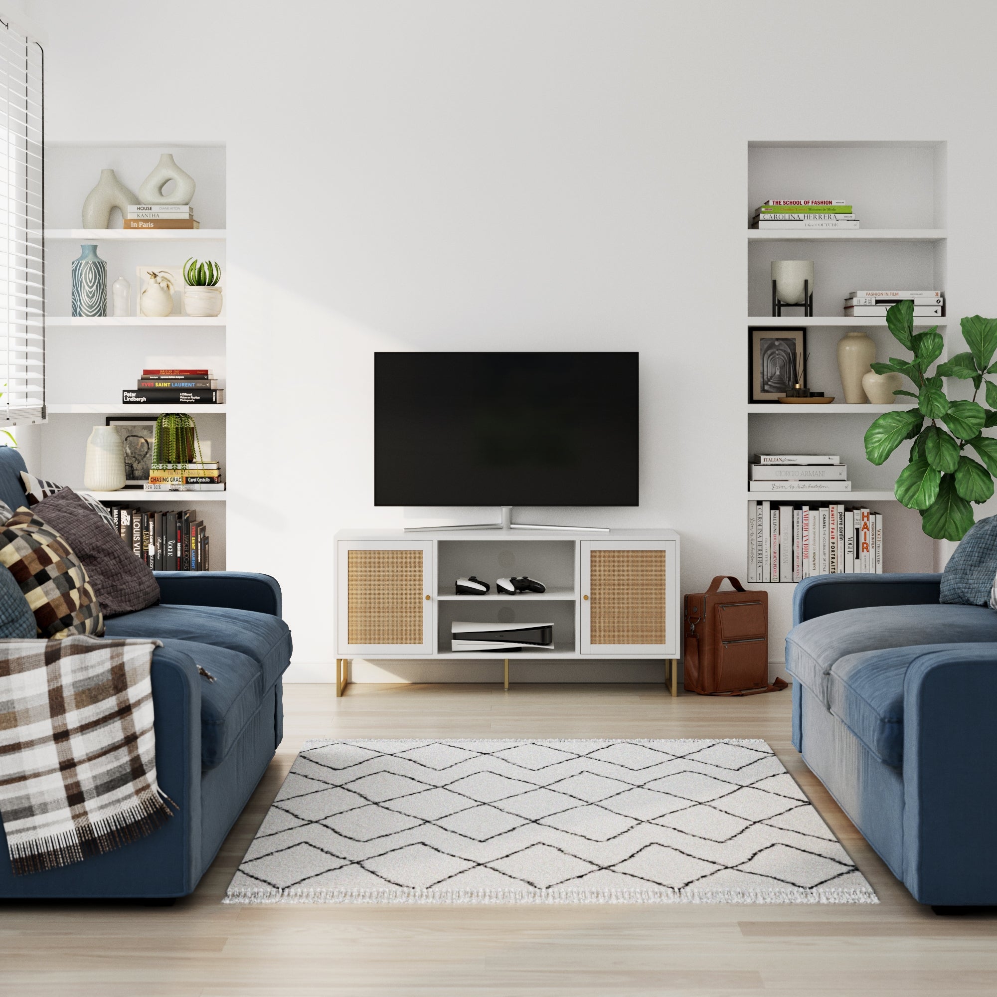 A modern living room with two blue sofas, a white rug with a geometric pattern, a TV on a white stand, built-in shelves with books and decor, a potted plant, and light wooden floors.