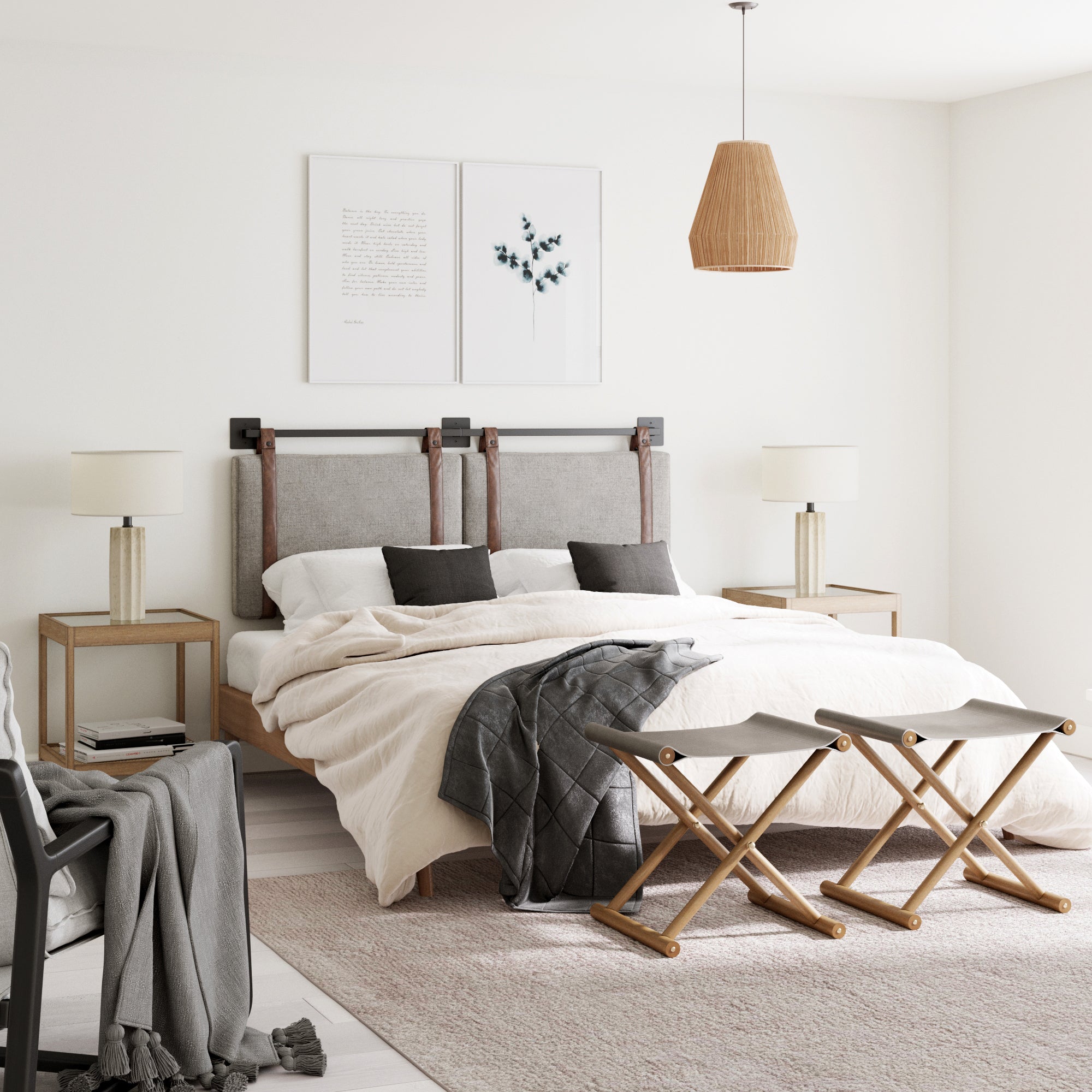 A modern, minimal bedroom featuring the Nathan James Upholstered Queen Wall Mount Headboard in gray, a large bed with light bedding, two wooden nightstands with lamps, pendant light, foot benches, and neutral beige and natural wood accents.