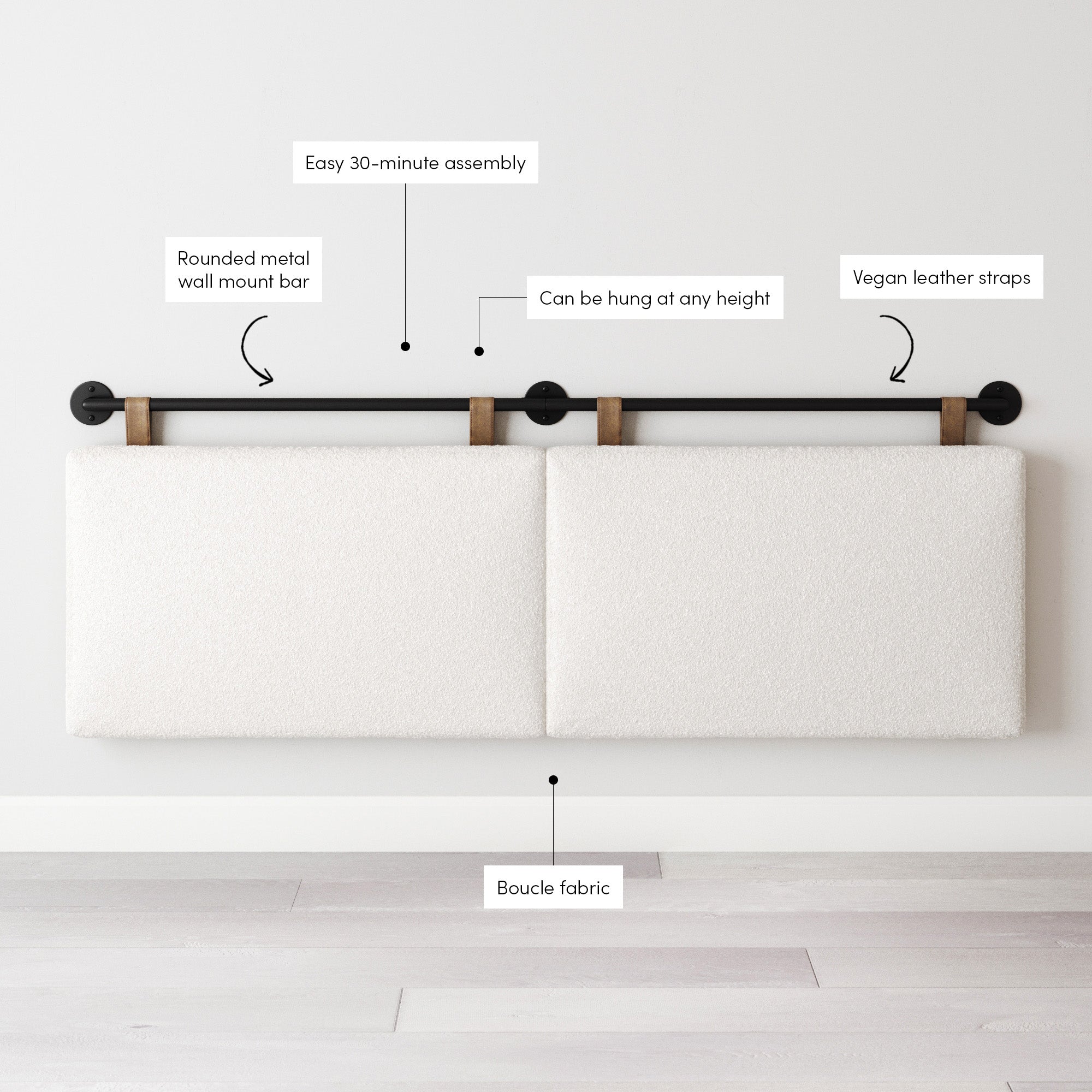 Wall-mounted headboard with two rectangular, white boucle fabric panels suspended by vegan leather straps from a rounded black metal bar. Labels highlight assembly time, wall mount bar, adjustable height, straps, and fabric.