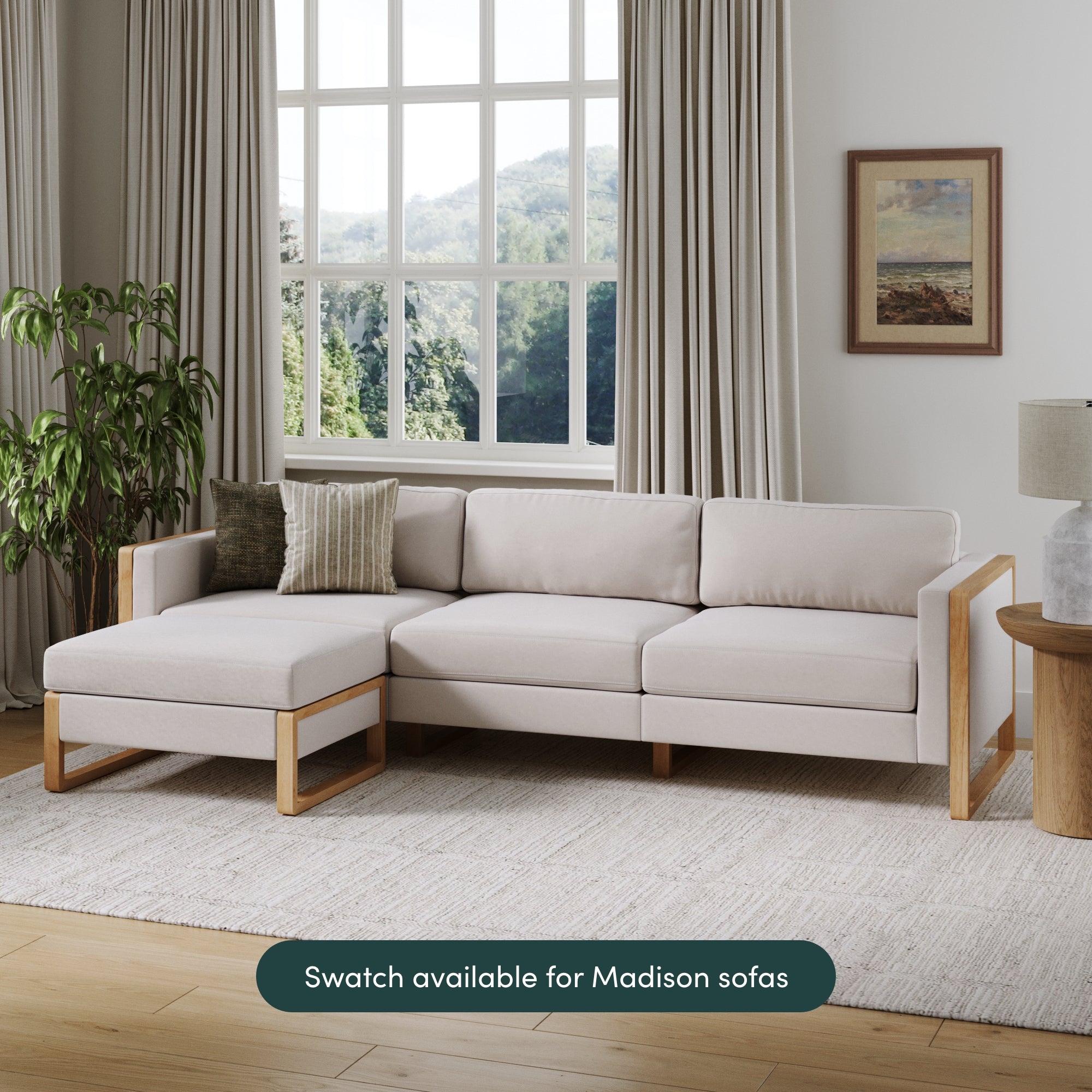 A modern living room features a light beige sectional, wood accents, plants, and art. Text reads: Free shipping on the Nathan James Textured Bisque Swatch—order to match your Madison sofa.