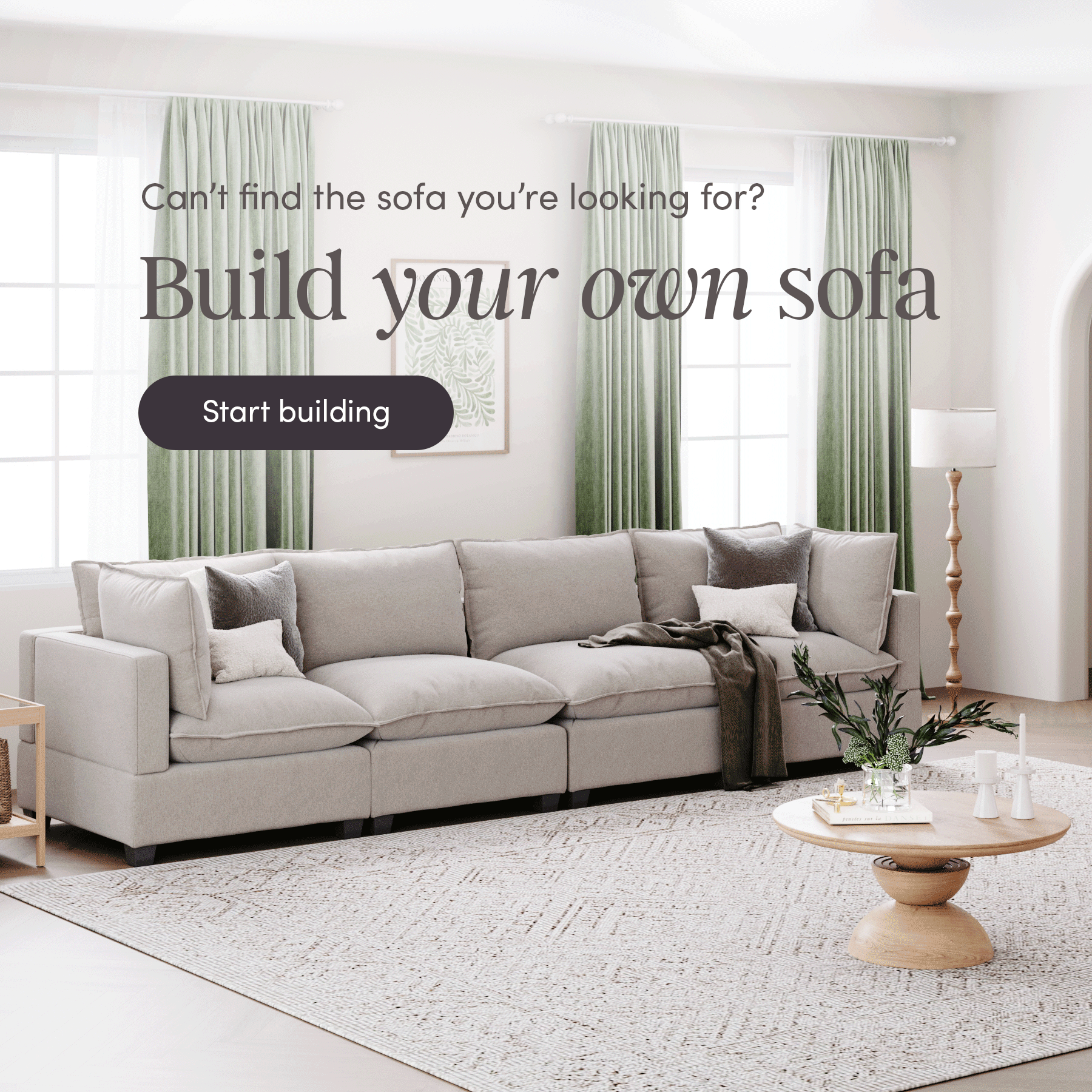 A modern living room with a large light gray sectional sofa, green curtains, a round wooden coffee table, and a rug. Text reads: Cant find the sofa you’re looking for? Build your own sofa. Start building.