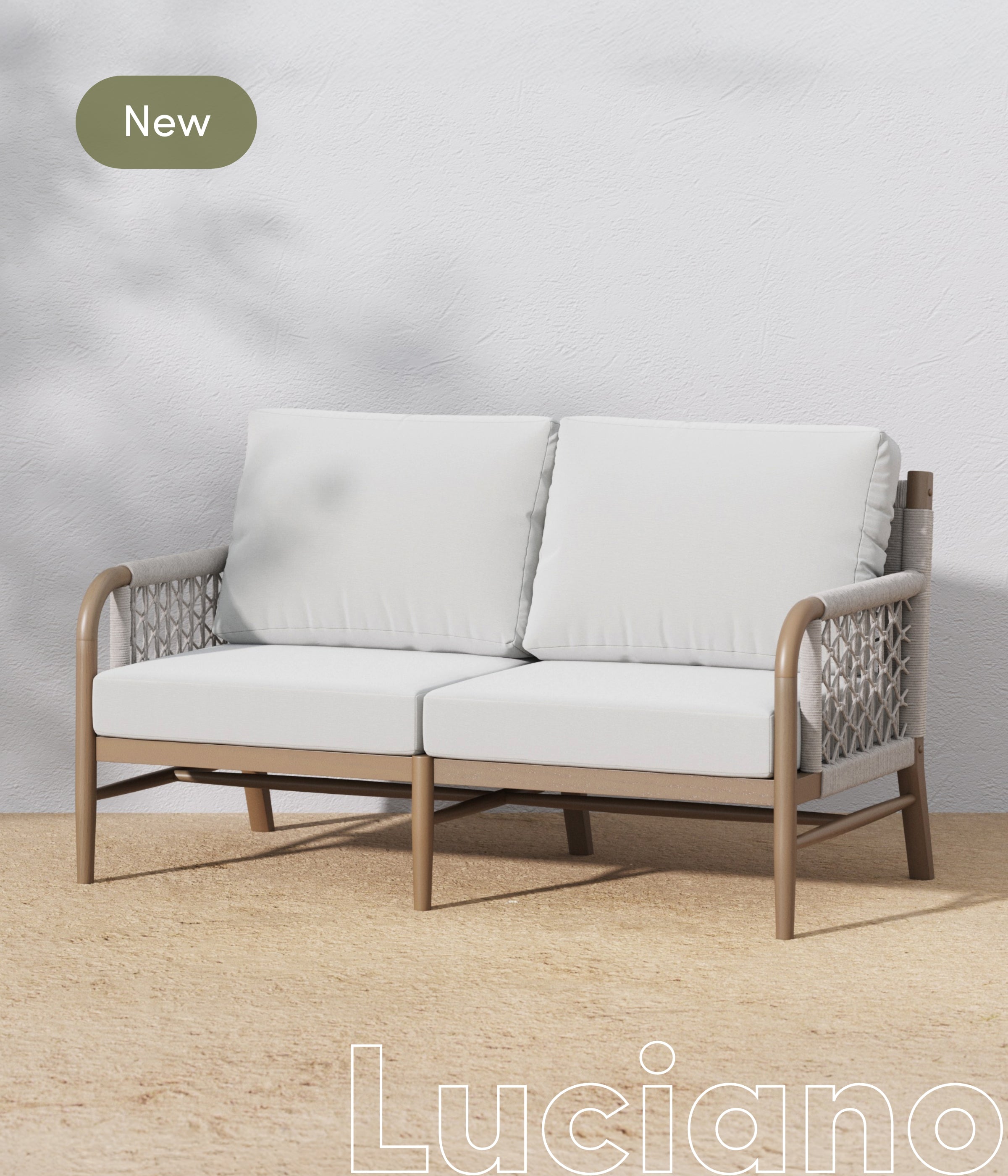 A modern two-seater outdoor sofa with light gray cushions and woven armrests sits on a tan floor against a white textured wall. A green label in the top left corner says New. The word Luciano appears at the bottom.