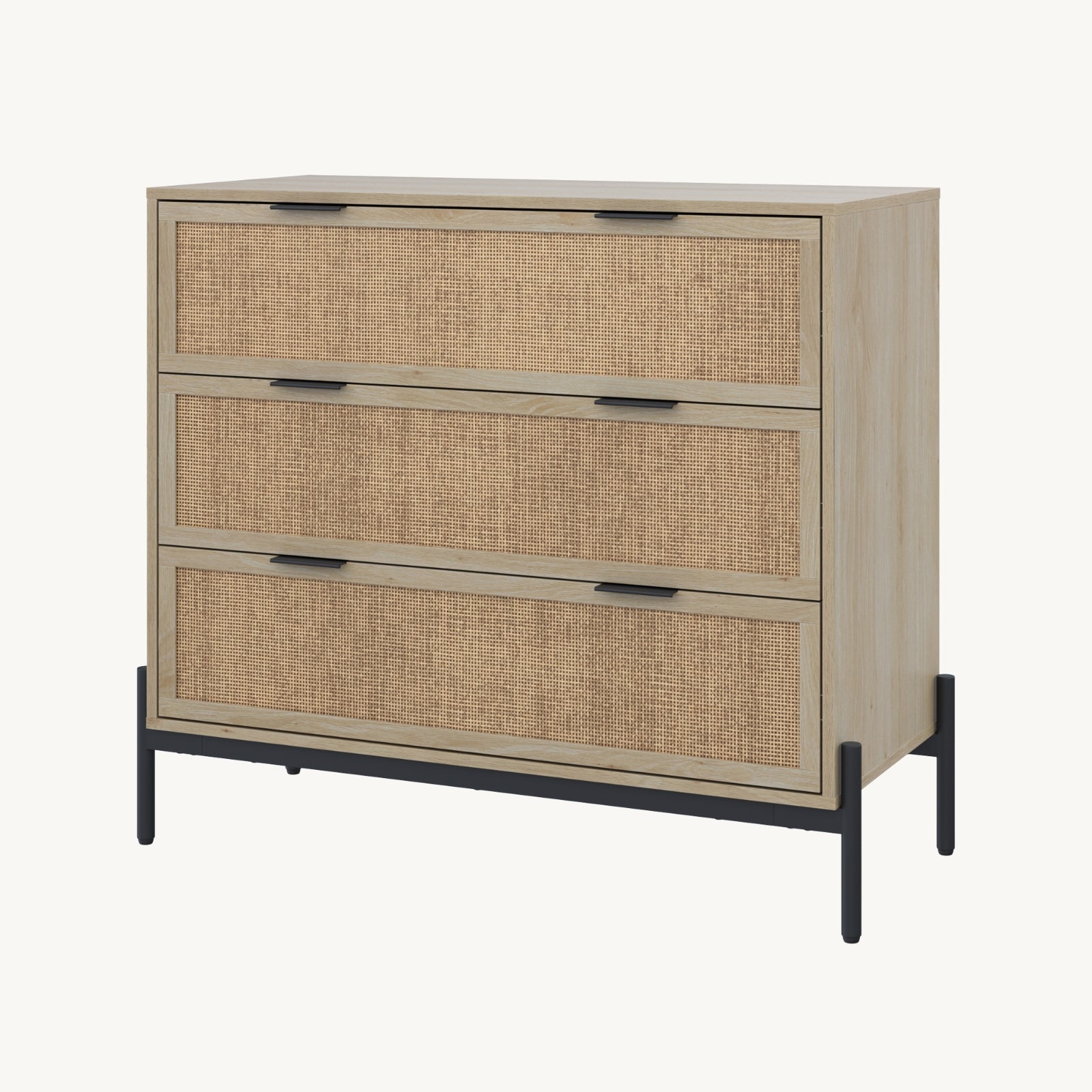 A light wood dresser with three drawers featuring woven rattan fronts, black metal handles, and black metal legs, set against a plain white background.