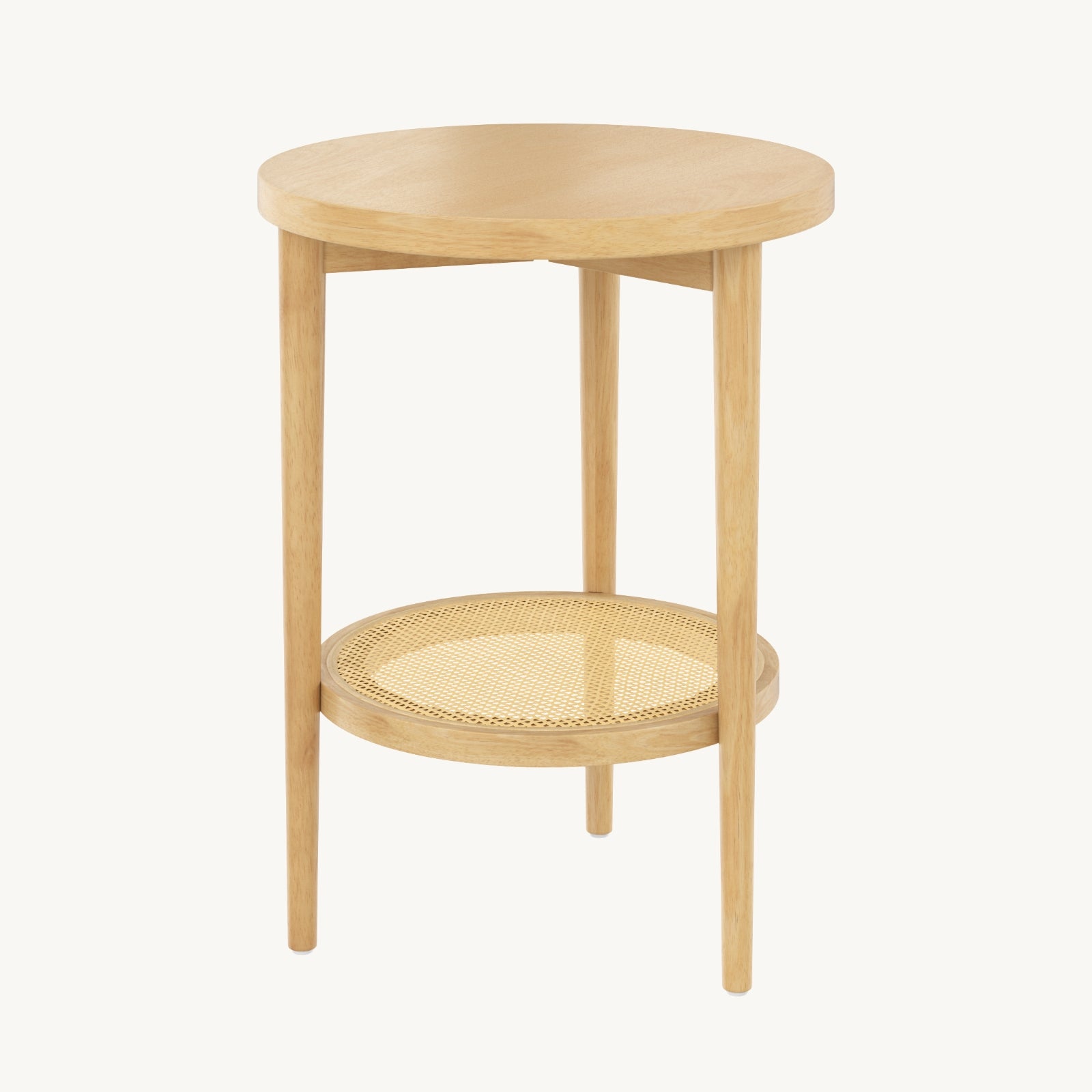 A round, light wood side table with three legs and a lower shelf featuring a woven cane pattern. The design is simple and modern.