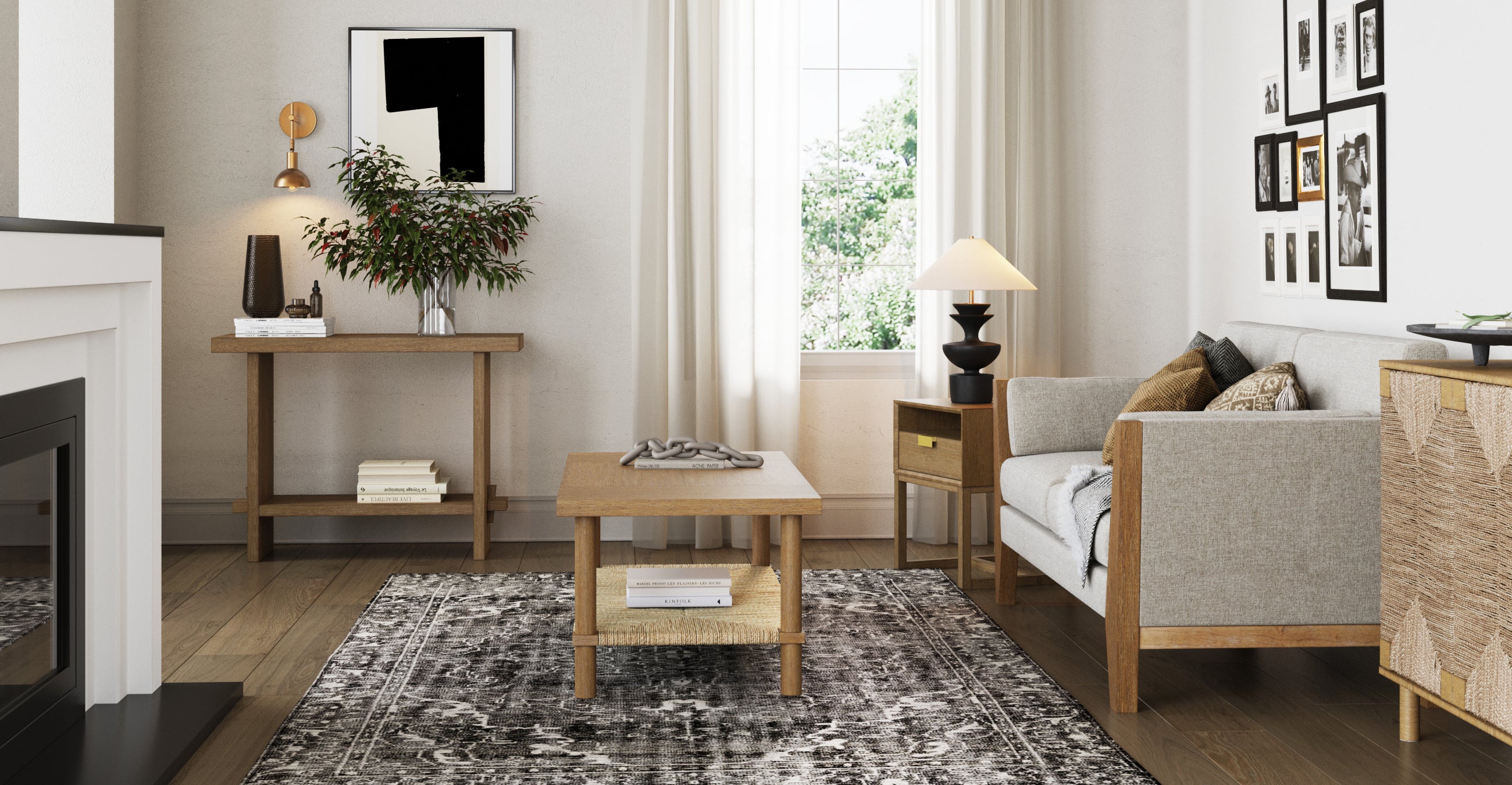 A cozy living room with a light gray sofa, wooden coffee table, side table with a lamp and vase, black and white rug, framed art on the walls, and a window with white curtains letting in natural light.