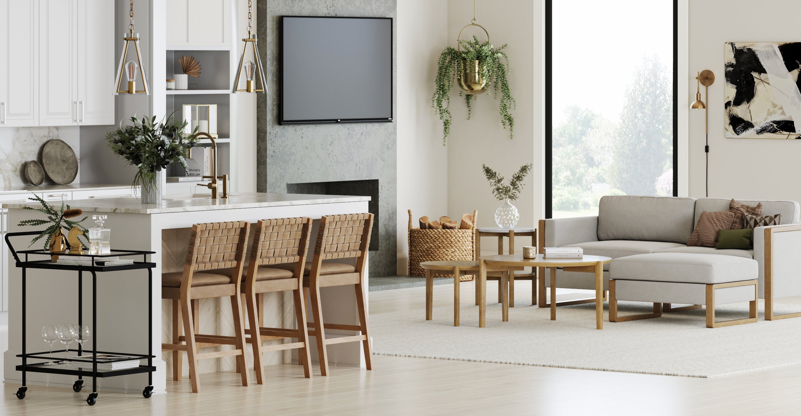Modern living room and kitchen with light wood floors, a white island with woven barstools, a gray sectional sofa, coffee table, wall-mounted TV, indoor plants, and large windows letting in natural light.
