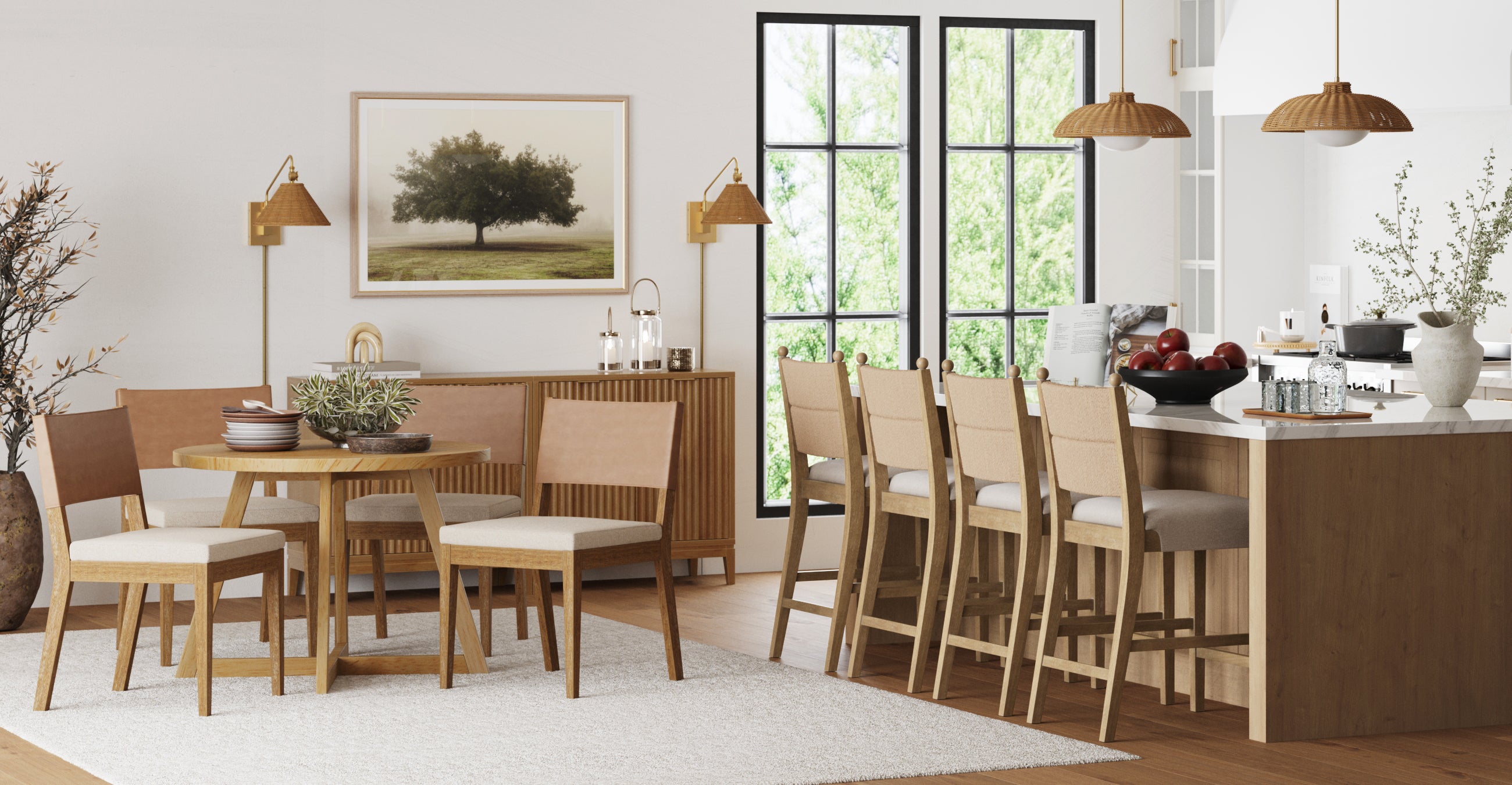 Modern dining and kitchen area with light wood furniture, beige chairs, a white rug, potted plants, pendant lights, and large windows letting in natural light. A framed tree photo hangs on a white wall.