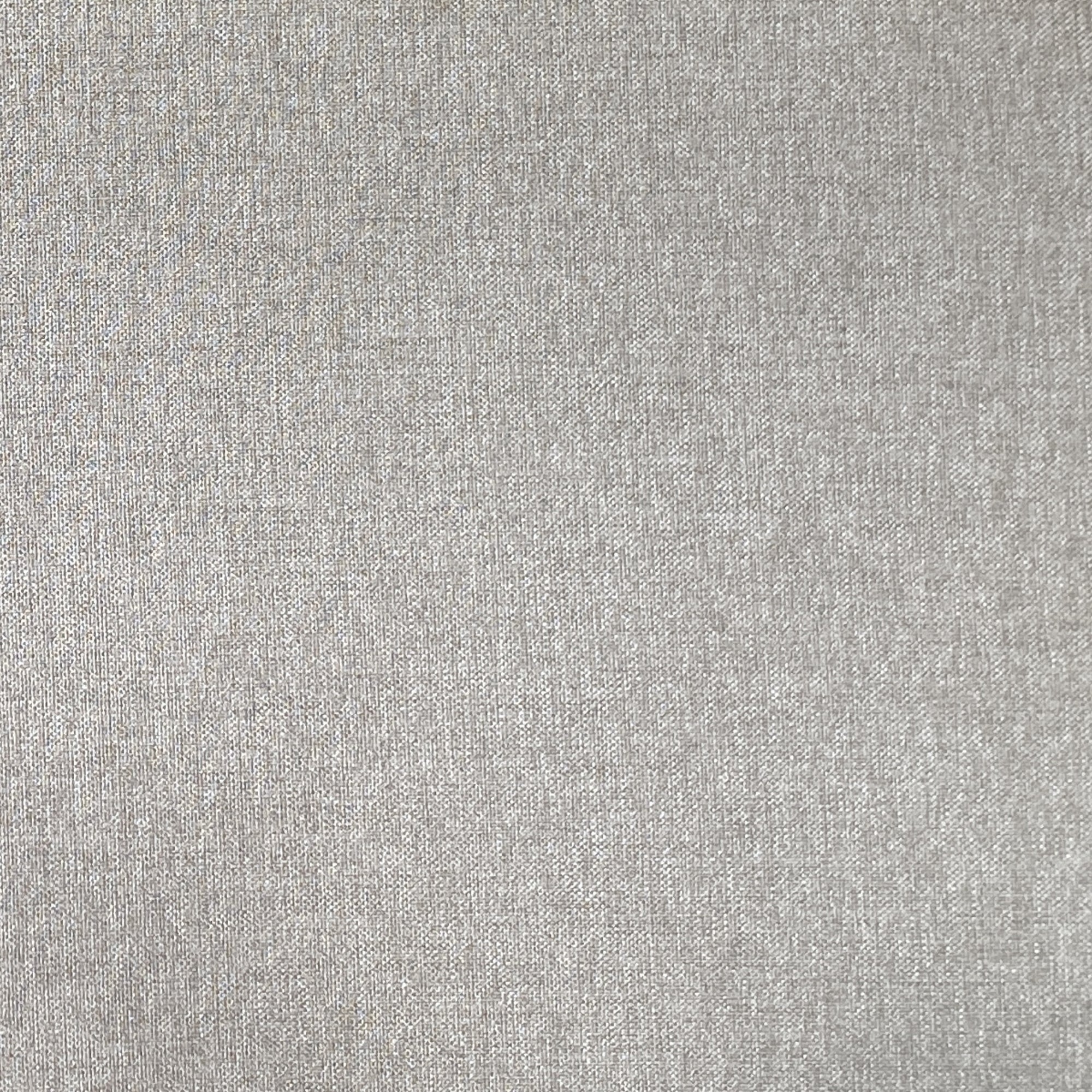 Close-up of a plain light gray fabric surface with a subtle woven texture and small visible fibers.