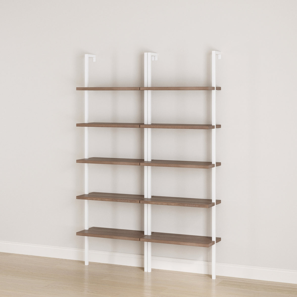 Two Nathan James Ladder Bookshelf Oak Matte White units with leaning ladder-style white metal frames and five wooden shelves each, set side by side against a wall.